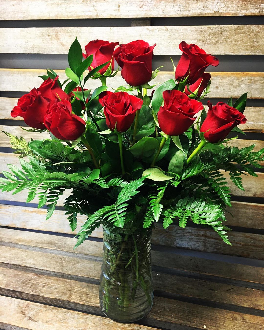   Red Rose Special  March deal  - One dozen RED roses arranged in a vase with greens. Rosa prima roses are simply amazing and long lasting! 
