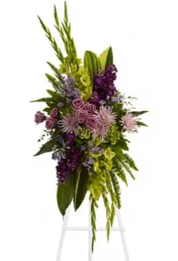 The Endless Sky Spray - Lavender blooms and lush velvet greenery evoke a celebration of a life well lived. A lovely mix of flowers such as lavender roses chrysanthemums statice and asters are beautifully complemented by glossy green aspidistra leaves fern and fragrant eucalyptus.Approximately 25" W x 54" H Orientation: One-Sided As Shown : DG250-2A