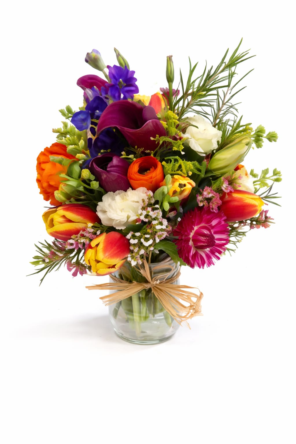 Sweet and Seductive Premium Garden Jar - FVSF - A joyful explosion of color and charm, the Sweet and Seductive Bouquet is designed to brighten any space and lift any spirit. This vibrant arrangement features a radiant blend of fresh seasonal blooms, including elegant tulips, sculptural calla lilies, soft carnations, textured green dianthus, delicate spray roses, fragrant stock, striking blue bella donna, and airy wax flowers. Together, these blooms create a lively palette of orange, purple, yellow, and magenta tones, accented with rustic greenery and natural wildflower-inspired texture for an effortlessly cheerful look.    Handcrafted with care and arranged in a clear glass jar, this bouquet is finished with a natural twine bow for a charming, rustic touch that complements both modern and classic décor. Whether you're celebrating a birthday, sending get-well wishes, expressing appreciation, or simply bringing a little sunshine indoors, this arrangement delivers warmth and personality in every stem.    Each bouquet is uniquely designed using the freshest flowers available. Seasonal availability may result in slight variations in flower types while maintaining the same bright color story and overall style. If substitutions are necessary, we will contact you with available options. Please feel free to reach out with any specific requests or questions about flower availability.    Featured arrangement: $85.75 (Regular Price).