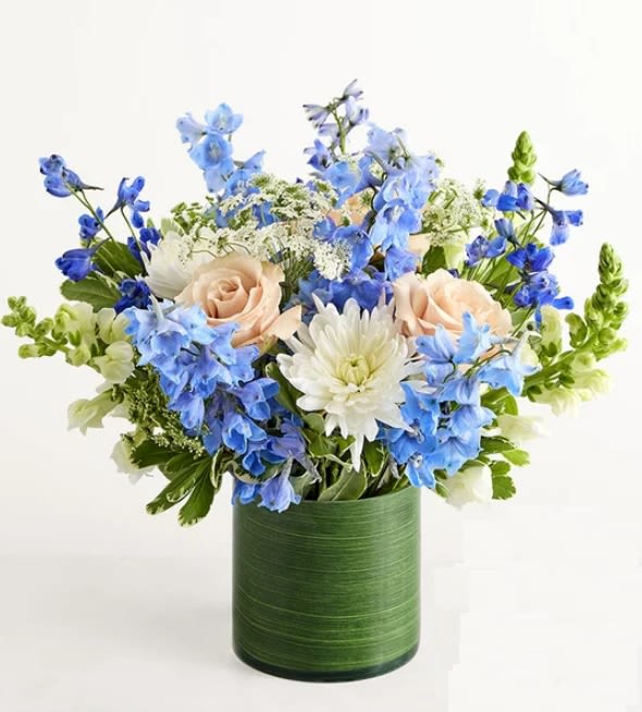 Cerulean Dreams bouquet  - NEW The blue delphinium is our 2026 Flower of the Year, and it’s easy to see why: Its vivid color and petite petals enliven any arrangement. Here pale roses, snapdragons, and other blooms complement the sunny delphiniums beautifully, making this bouquet 