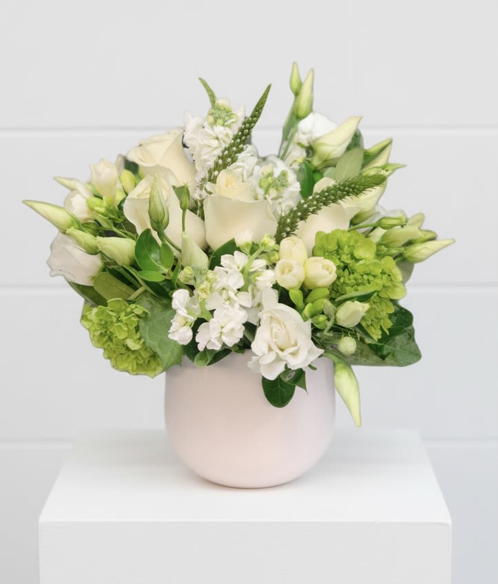 Simple Whites - Pure white flowers, in a cylinder vase, are perfect for any occasion 