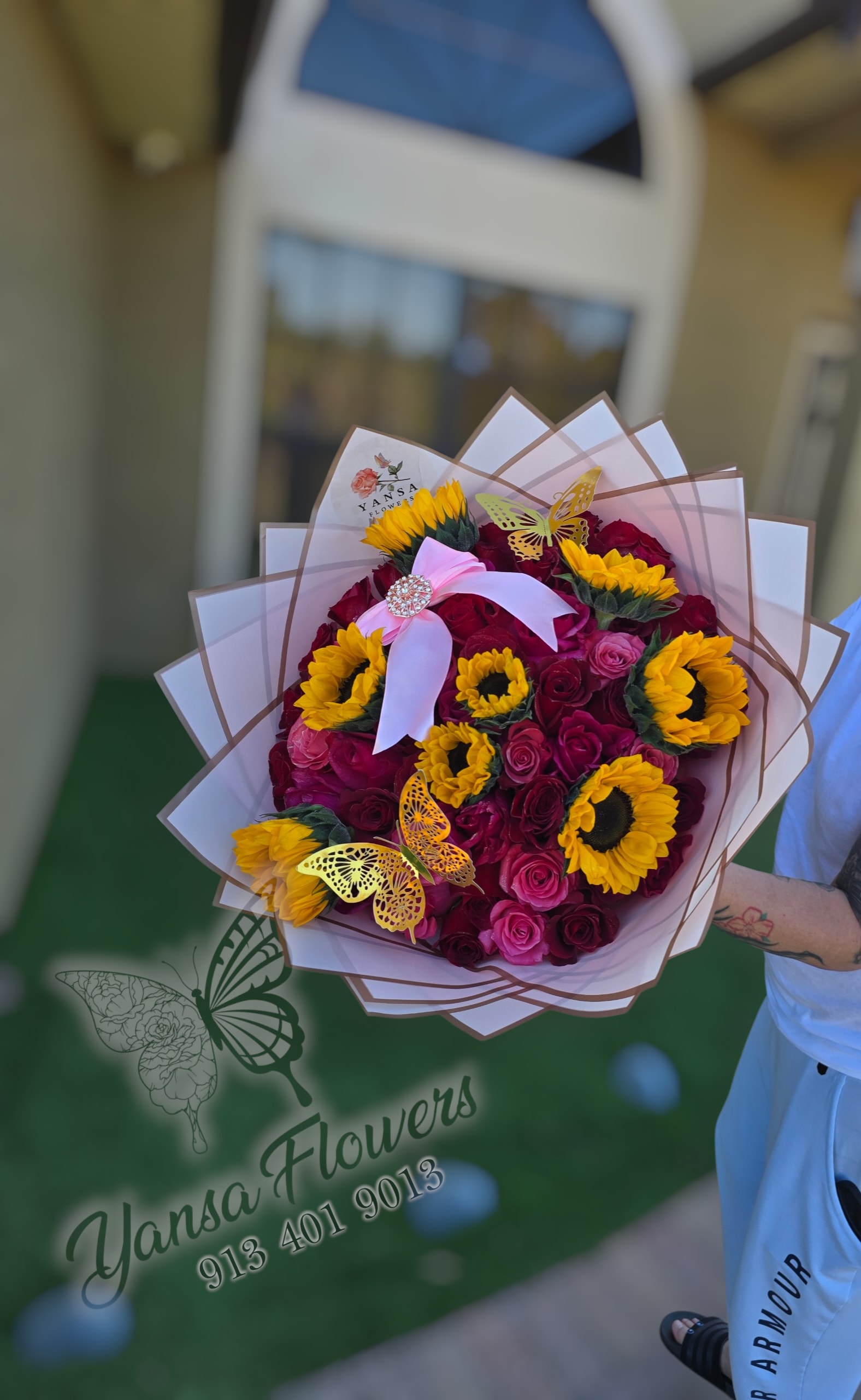 50 Roses &amp; Sunflowers Premium Bouquet - The breathtaking arrangement of 50 roses mixed with vibrant sunflowers, wrapped in elegant style to create a bold and unforgettable floral statement.  Perfect for celebrations, love, and special surprises.