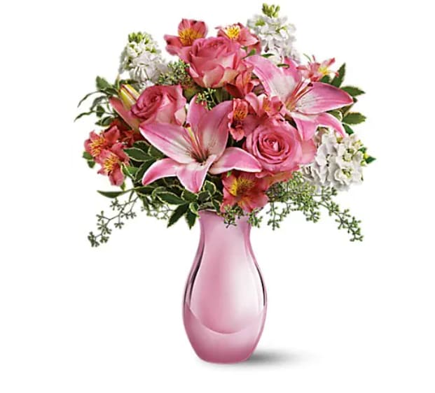  Pink Reflections Bouquet with Roses (Deluxe Pictured) - *Picture is of Deluxe Arrangement*  Oh, so pretty in pink, this beautiful bouquet will make any woman's day. With so many pretty flowers in such a uniquely beautiful vase, this can't-miss gift is perfect for Mother's Day, a birthday, any day! Pink roses and asiatic lilies, dark pink alstroemeria, white stock and seeded eucalyptus are splendidly arranged in an pink reflections vase. Sending this charmer will be a great reflection on you!   Orientation : All-Around  