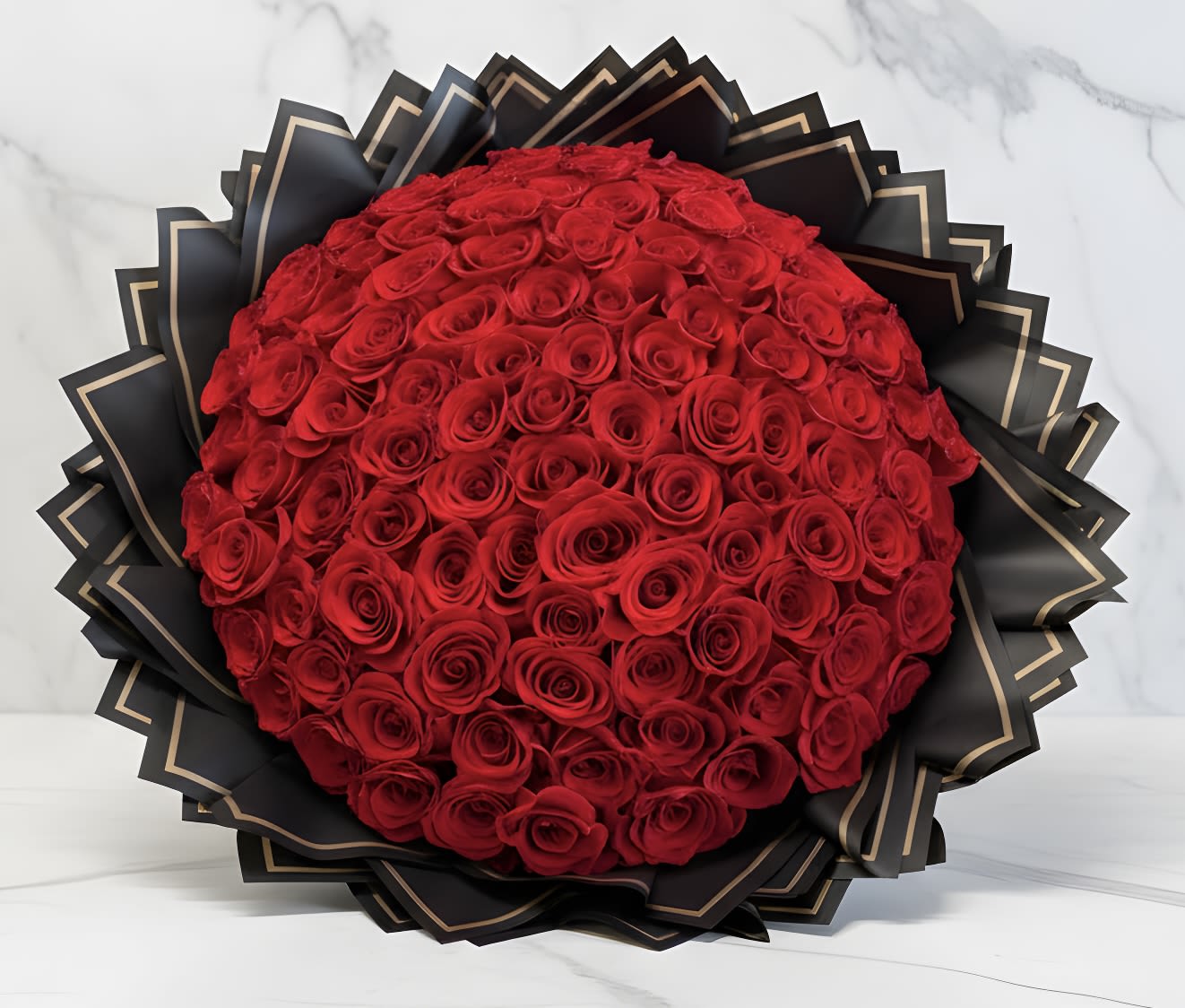 Grand Red Roses Wrapped  Bouquet (100, 150, 200 Roses)  - STANDARD 100 ROSES DELUXE 150 ROSES PREMIUM 200 ROSES Red rose bouquet is a captivating arrangement, designed to exude romance, elegance with a touch of glamour! The bouquet features lush, deep premium red roses.