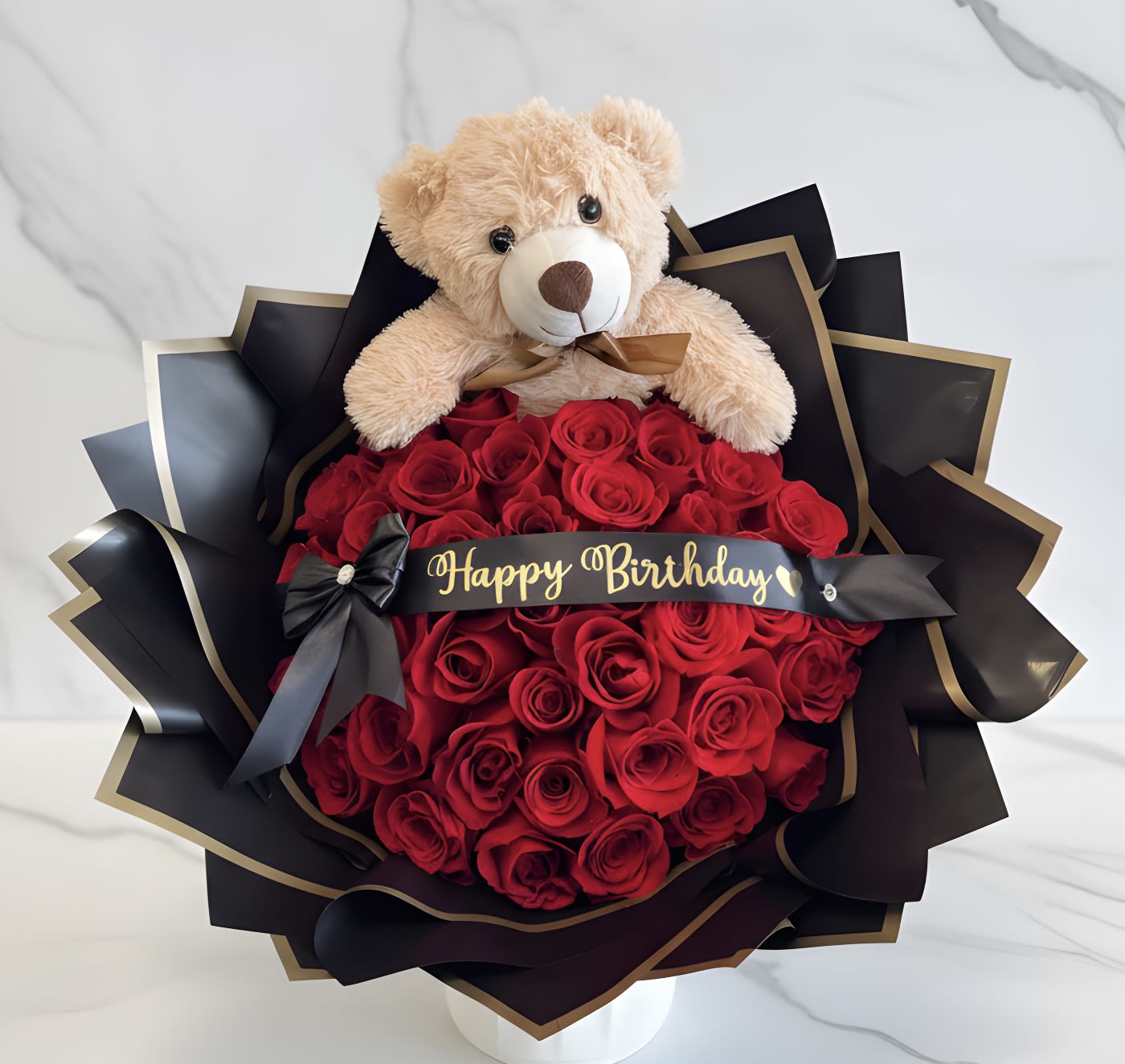 Teddy Bear Birthday Bouquet - A teddy bear rose bouquet is a charming and whimsical arrangement that combines roses with an adorable teddy bear comes with Happy Birthday Banner. STANDARD 24 ROSES DELUXE 36 ROES PREMIUM 50 ROSES