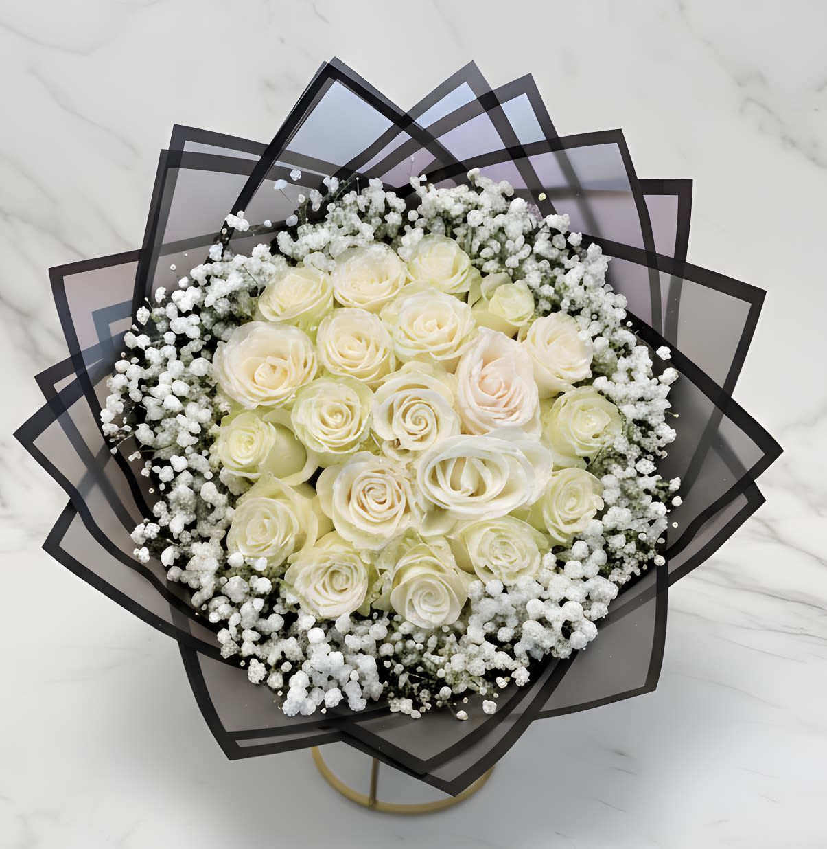 Bouquet of cream roses with white baby's breath in black wrap