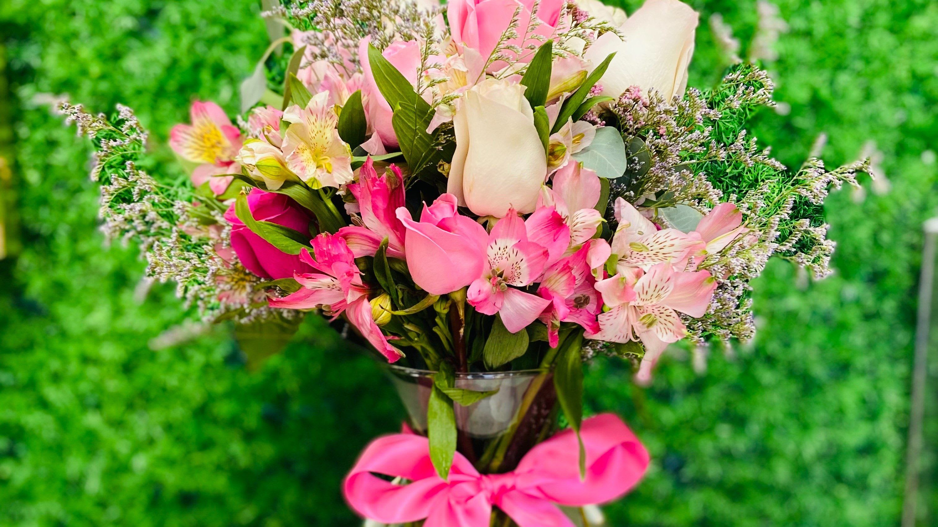 True Love - Bring a burst of sunshine indoors! This lively arrangement celebrates the beauty of pink in every shade—from soft blush to electric fuchsia. With its mix of classic roses and exotic-looking Alstroemeria, it’s a joyful gift that’s perfect for saying 'Thank You,' 'Congratulations,' or just brightening someone's day.