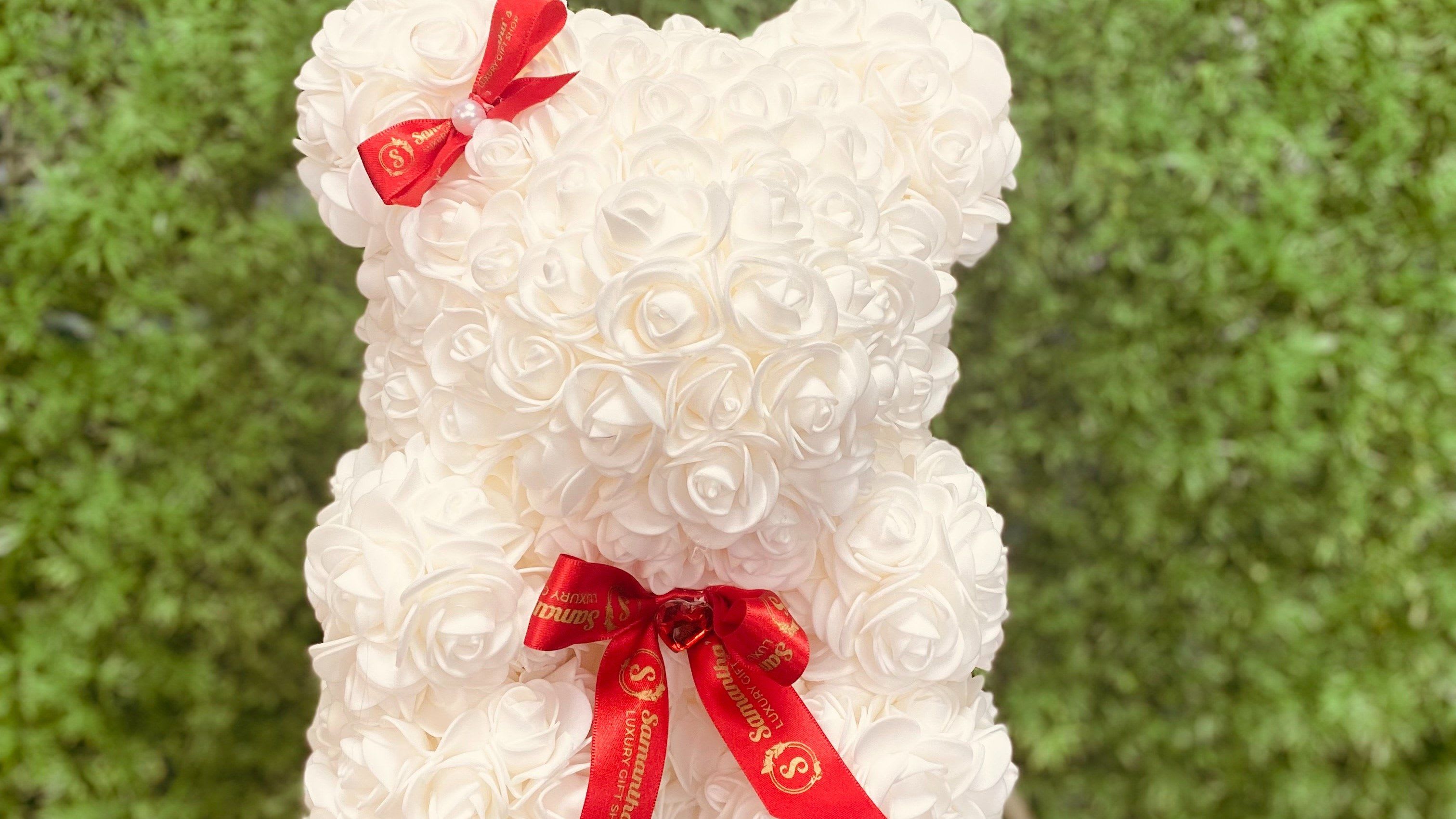 Lil' Bear Sweet Treat  -  Give a gift that lasts forever! Our beautiful mini rose bears are handmade with soft foam petals and come paired with a classic box of Ferrero chocolates.  Size: Small  Bonus: Ferrero Rocher box included!