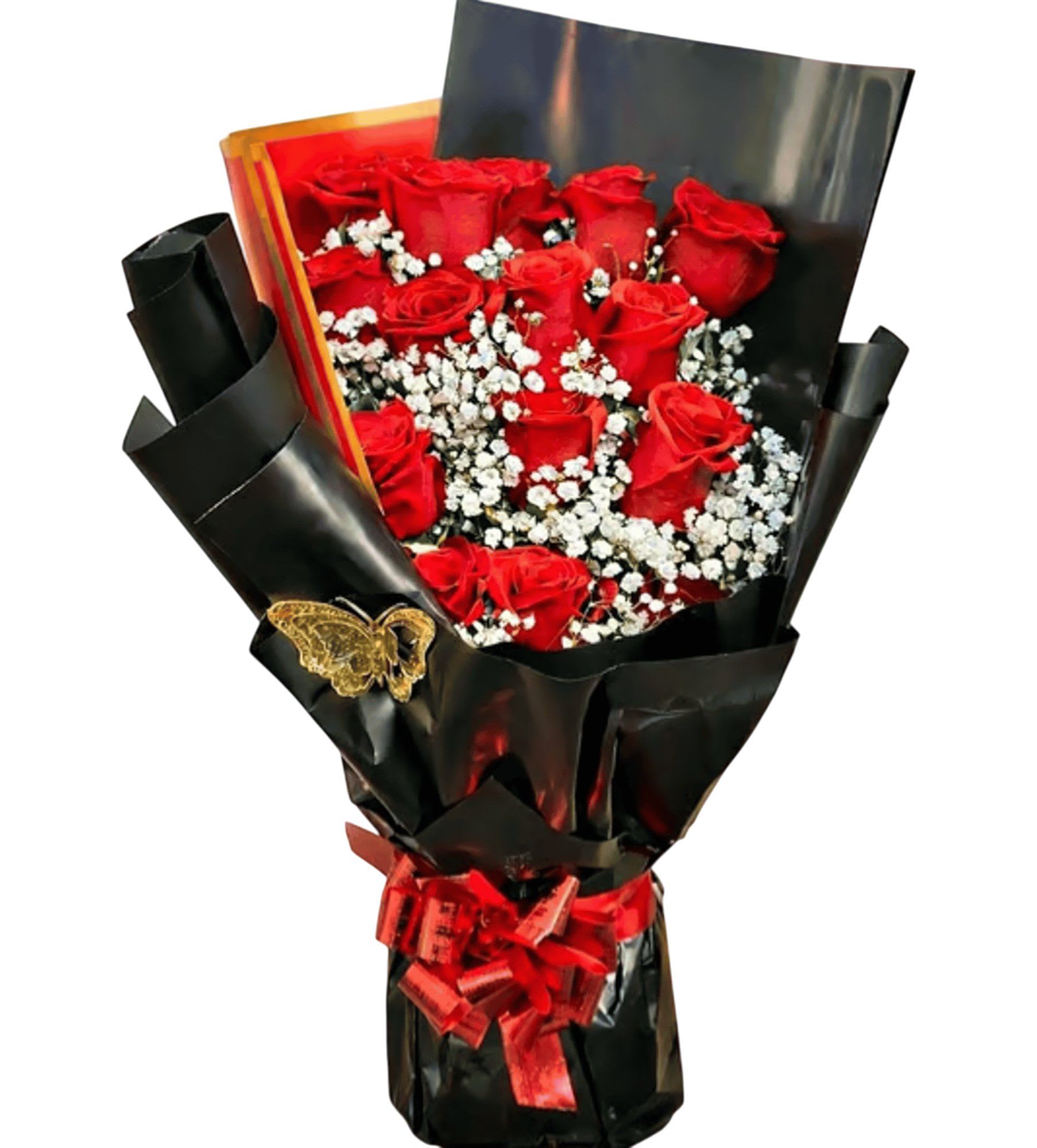 Midnight Romance  - Midnight Romance Rose Bouquet Make a grand statement with this stunning arrangement of 15 premium long-stemmed red roses. Nestled in a delicate bed of airy baby’s breath, these blooms are presented in a sleek glass vase and artfully hand-wrapped in sophisticated matte black paper. Accented with shimmering gold butterflies and a classic red ribbon, it’s the perfect gift for anniversaries, birthdays, or "just because."