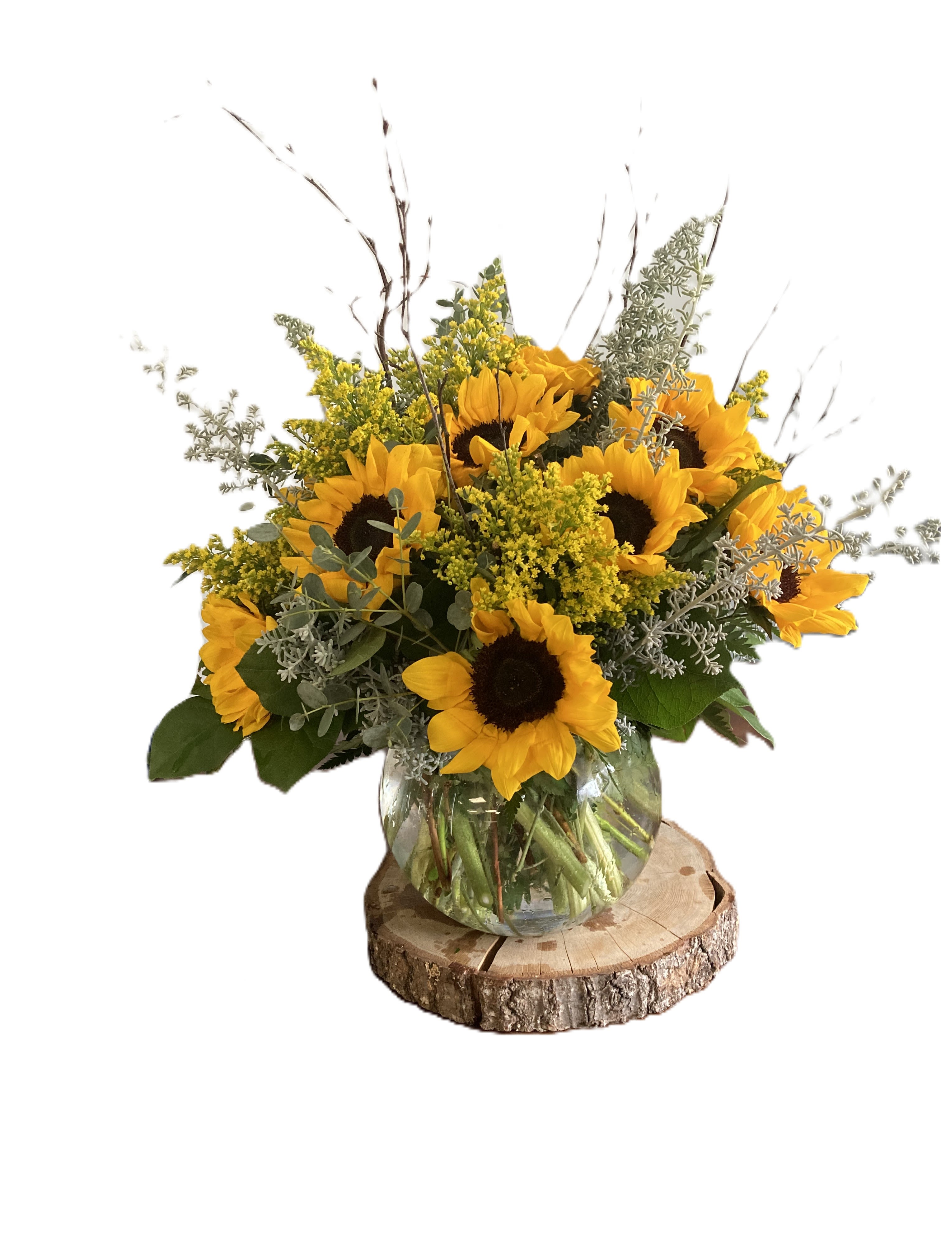 sunflower beauty - this beautiful heart shaped wreath is made up of pink, yellow and lavender roses with seeded eucalyptus as the greenery will certainly brighten someone's day.