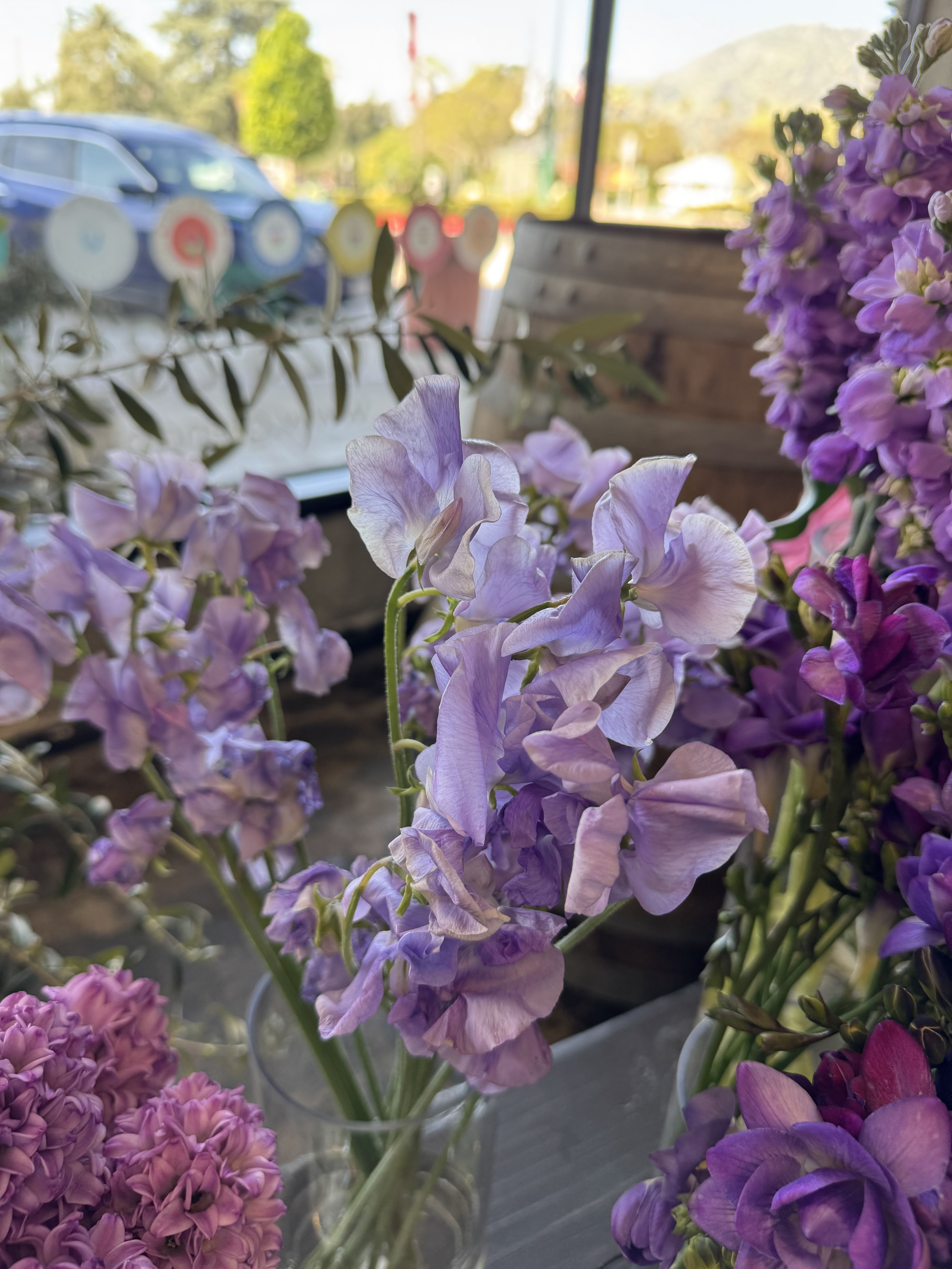 Sweet Peas - Flower Market - Color varies on availability. You may request but color is not guaranteed.  Standard - Bunch of 10 stems Deluxe - Bought by the stem Premium - Bought by bunch 10+