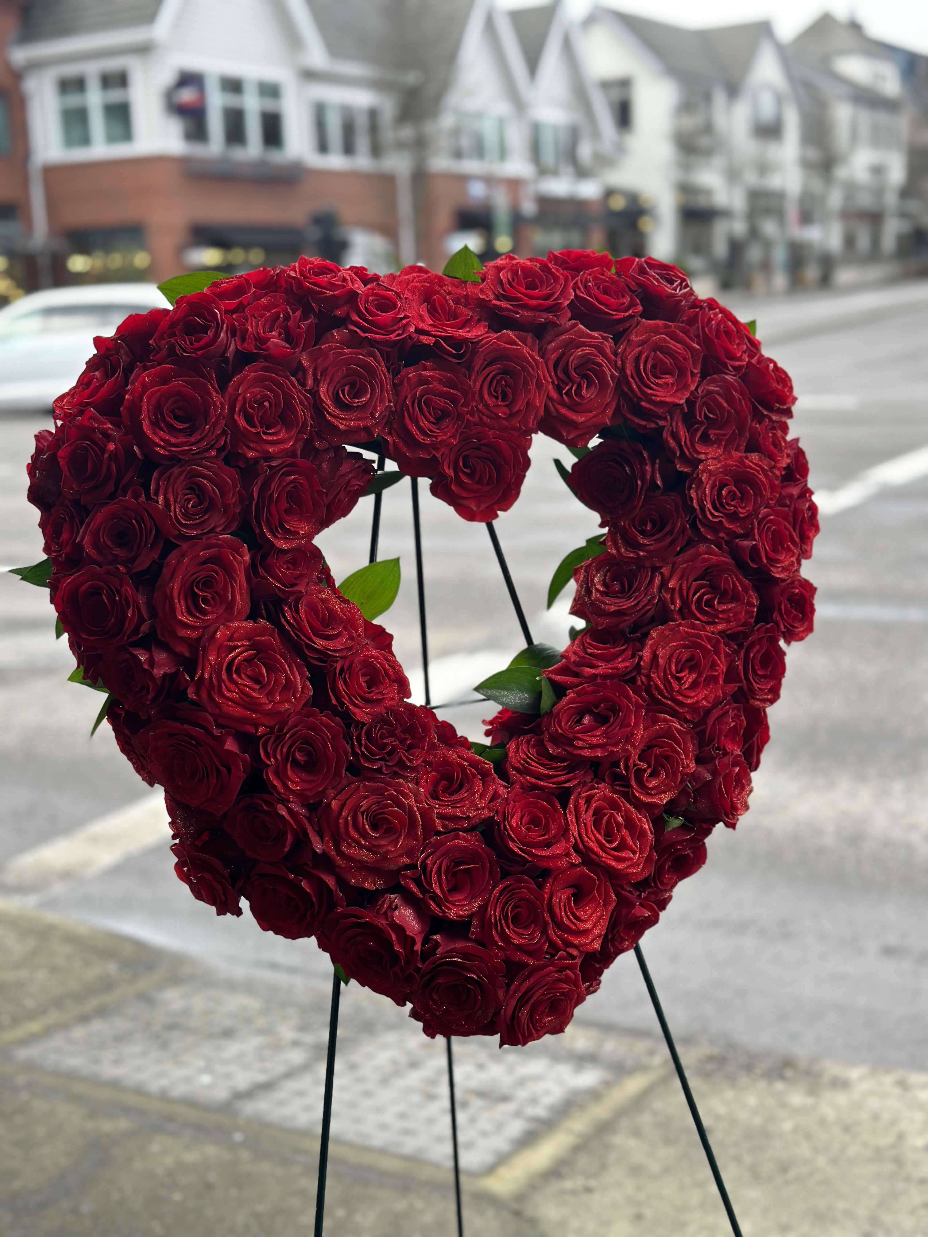  FUNERAL ,Love in our Hearts - When words alone aren't enough to express the strength of your love ,this impressive heart-shaped arrangement makes an unforgettable statement .Handcrafted by our caring florist using red roses in a solid heart -shape ,its a beautiful tribute best suited for the funeral service .Heart -shaped arrangement of over 100 deluxe roses will be unforgettable to everyone.    any colors is available by your request.