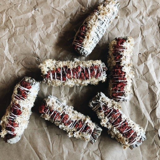 BOTANICAL Smudge Stick Red - Cleanse your space, body and mind. red: sage + panacium and red satice. To use: light your sage stick over your flameproof bowl until a small flame has caught. while holding your sage over the bowl lightly blow on the flame until it goes out. The sage will then smoke gently like incense.