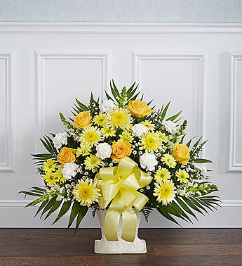 Heartfelt Tribute Floor Basket Arrangement - Product ID: 91206   When dealing with the loss of a family member, friend or colleague, finding the perfect expression of sympathy can be difficult. Featuring a tasteful gathering of fresh yellow roses, white carnations and more, our heartfelt floor basket arrangement will help you convey all the comfort and support thatâs in your heart when words just donât seem to be enough. Floor basket arrangement of fresh yellow roses, cremones, white gladiolas, carnations, monte casino and more Appropriate for family, friends or business associates to send directly to the funeral home Our florists use only the freshest flowers available, so colors and varieties may vary Large arrangement measures approximately 32"H x 38"L Medium arrangement measures approximately 32"H x 32"L Small arrangement measures approximately 32"H x 30"L