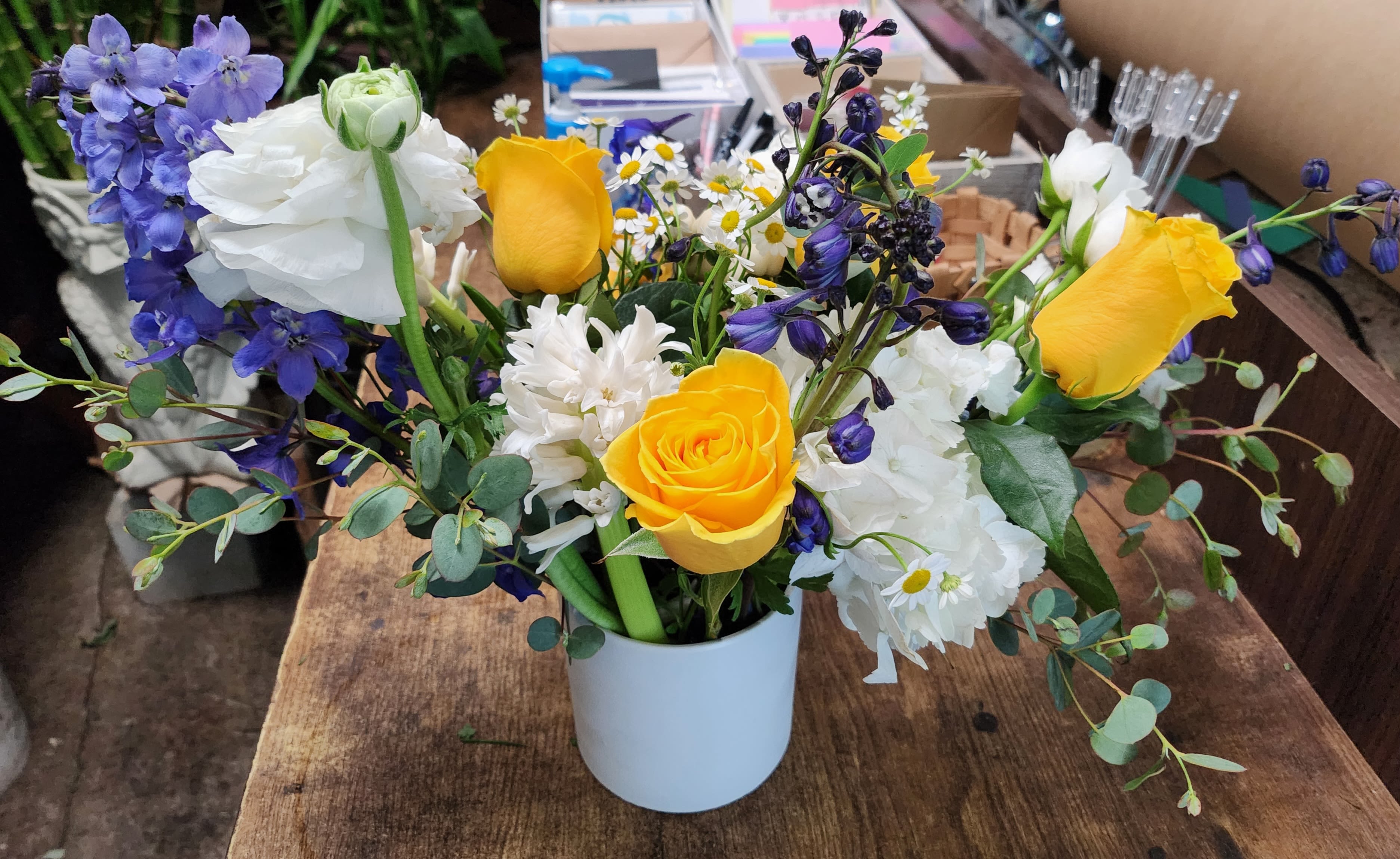 Ken - Fresh Blue delphinium and white flower arrangement touch with yellow
