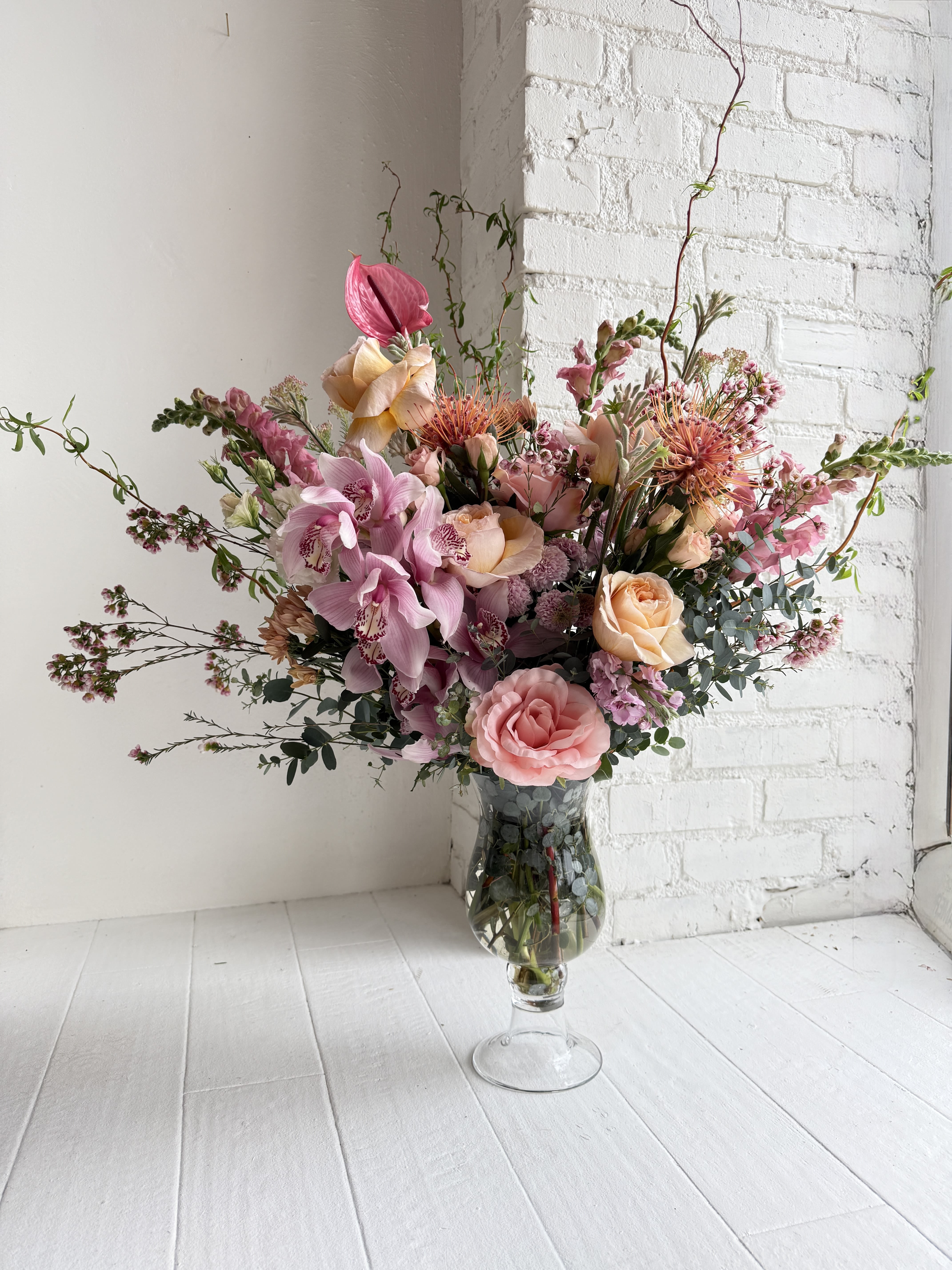 Margot - A stunning tall arrangement consisting of light pinks, peach and light foliage. This stands about 3 feet high and 2.5 feet wide. 
