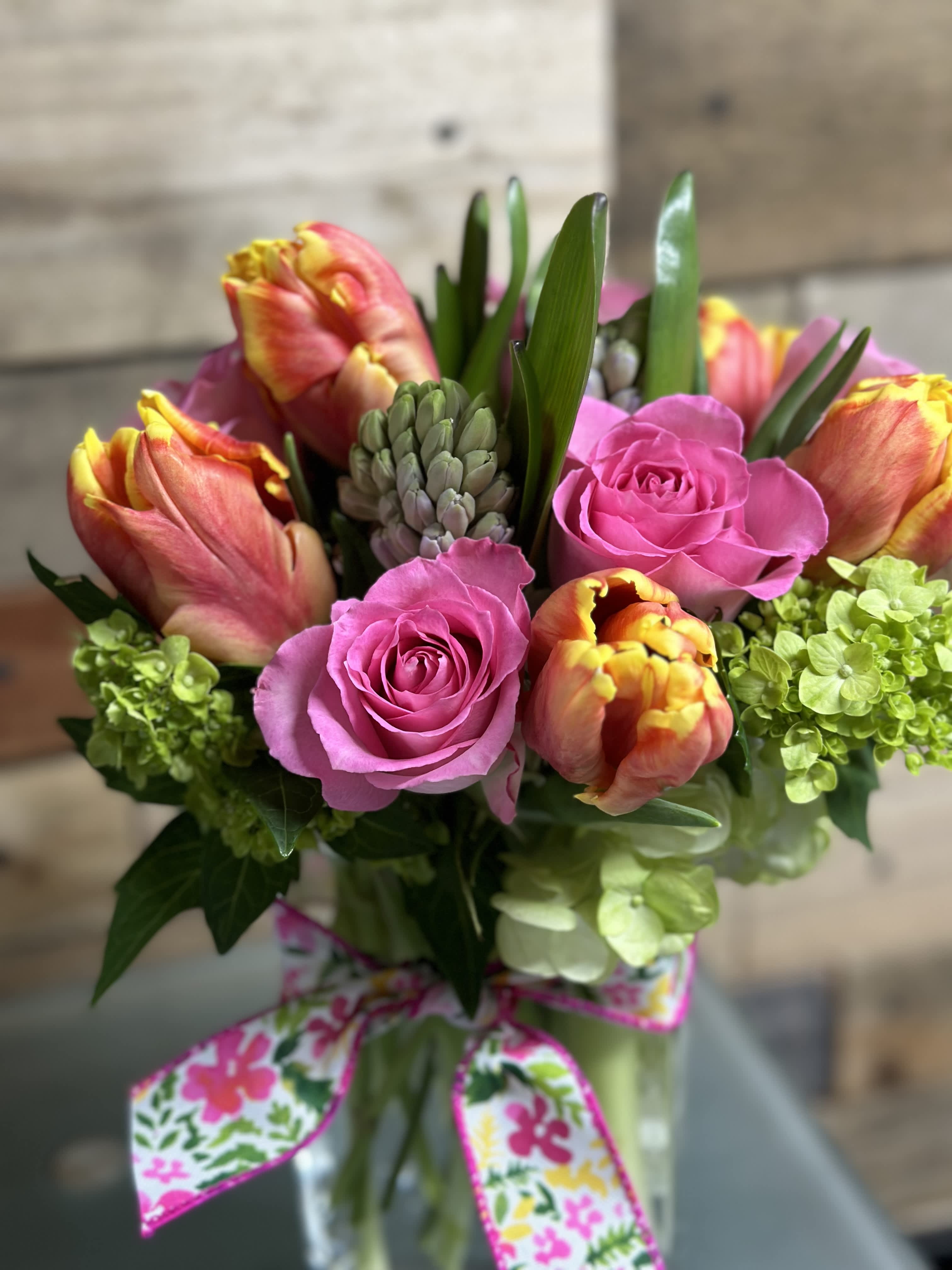 Spring Fling - Our Spring Fling is sure to brighten anyones day with the array of colors, fragrances and beautiful mix of spring flowers! Flowers and Colors may vary due to availability. Shown as deluxe