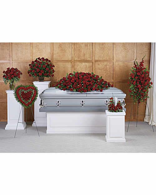 Crimson Tribute Set - The Crimson Tribute Collection is a beautiful six-piece funeral floral set designed to create a cohesive and meaningful display of remembrance. Featuring rich red blooms such as premium roses, spray roses, and lush greenery, this collection brings warmth, dignity, and heartfelt honor to a loved one’s service. Each arrangement is thoughtfully designed to work together, creating a striking and unified tribute.