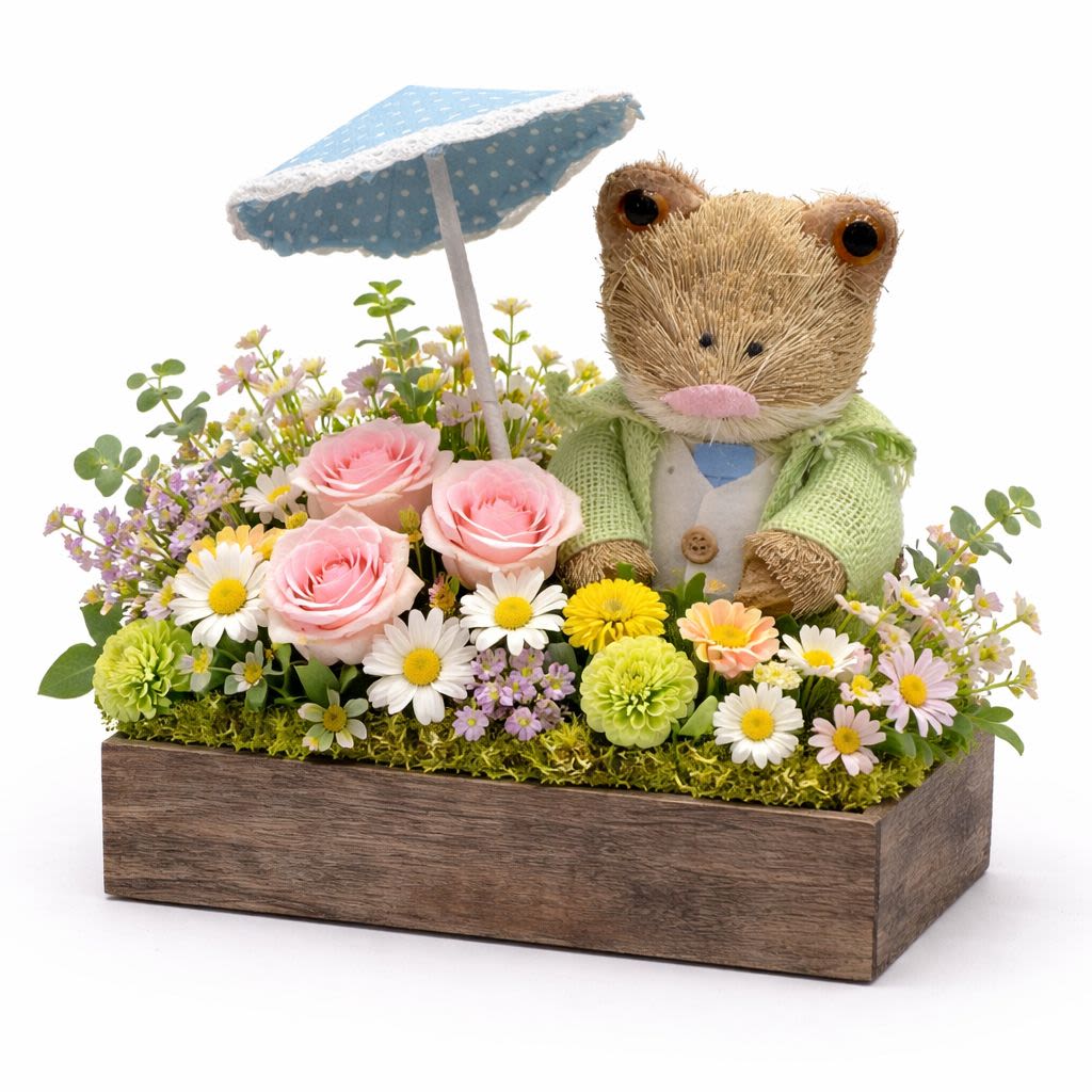 Blossom Garden Box - A delightful spring floral arrangement designed in a rustic wooden box with charming garden accents. Soft seasonal blooms and fresh greenery create a cheerful garden-inspired design that brings the beauty of spring indoors.  Better For: Spring celebrations, Easter, Birthdays, Thank you, Home décor, Just because.  Flowers and decorative accents may vary based on availability. Our designers will select the freshest blooms while maintaining the same overall style, color palette, and garden-inspired feel of the arrangement