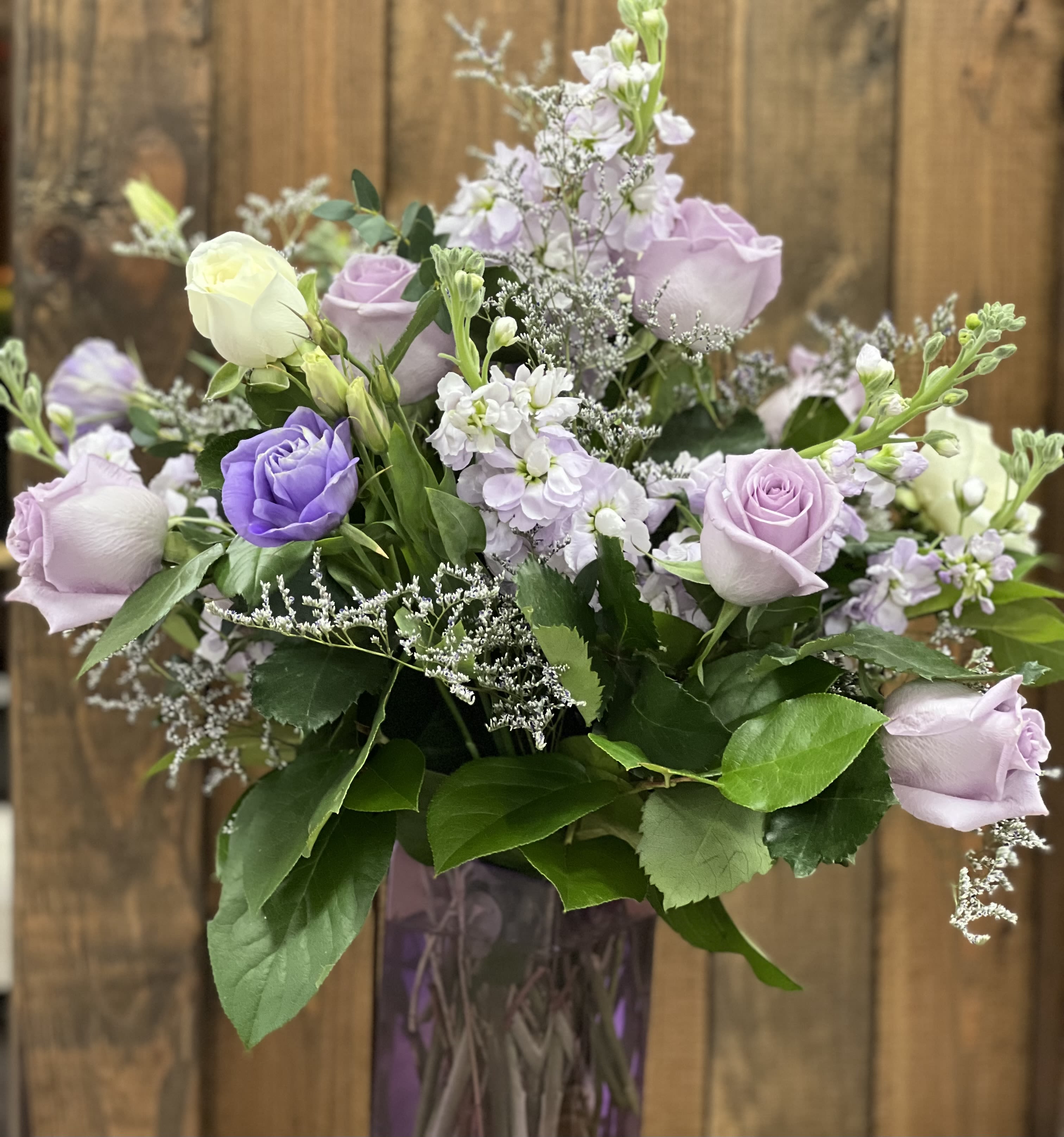 Purple Haze - The arrangement features a rich variety of purple flowers, creating a visually captivating display that exudes elegance and tranquility. The combination of differet shades and textures brings depth and interest to this bouquet.