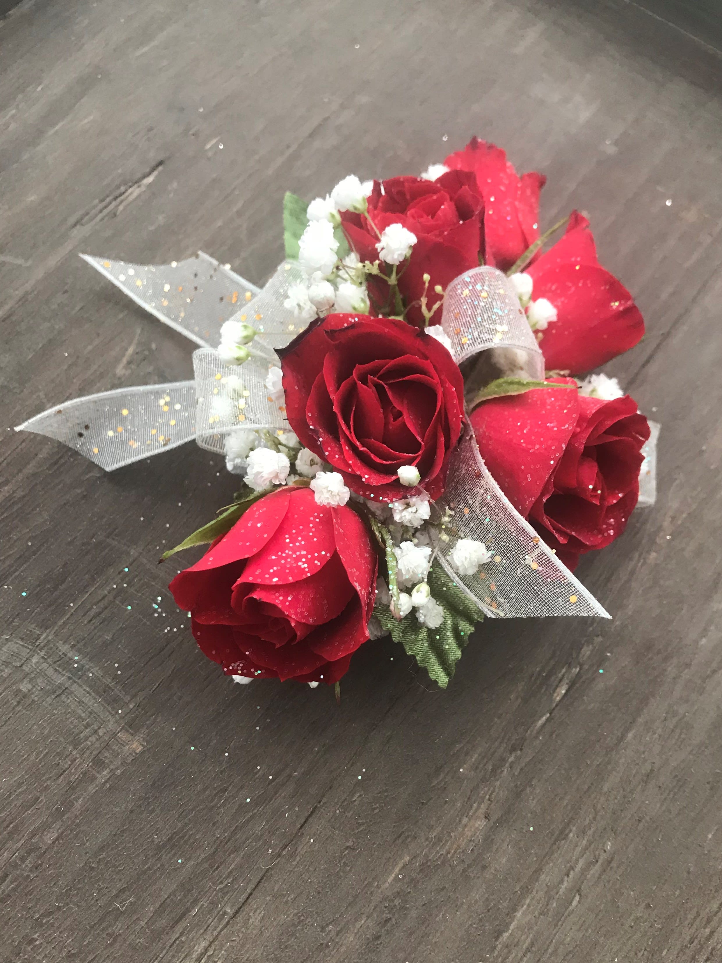 Single Ribbon Spray Rose Corsage - Spray Roses of your color choice with ribbon accent of your color choice. Designed on an elastic band and finished off with babies breath.
