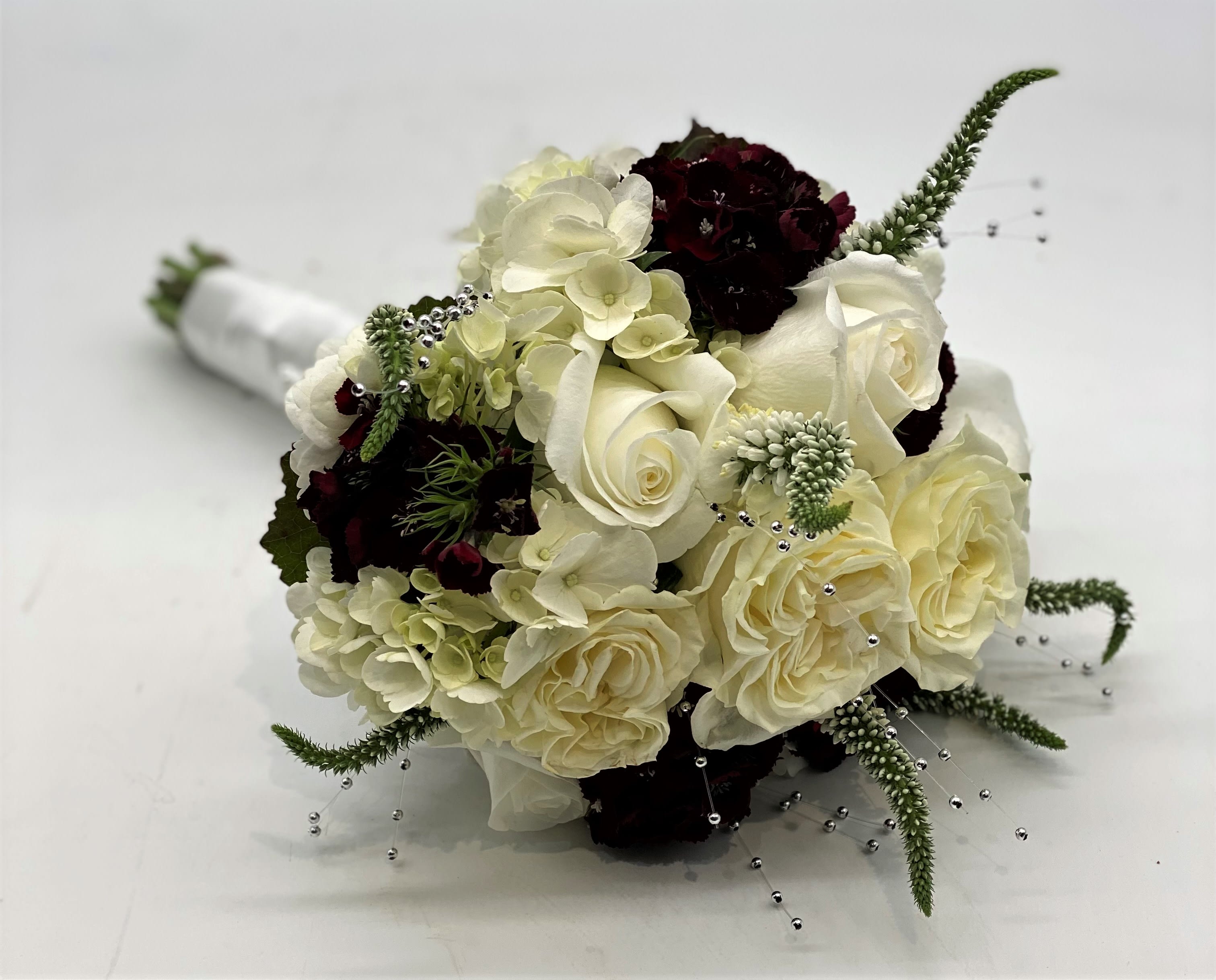 The Silver Dreams Clutch Bouquet - Lush whites, burgundy and pops of silver!