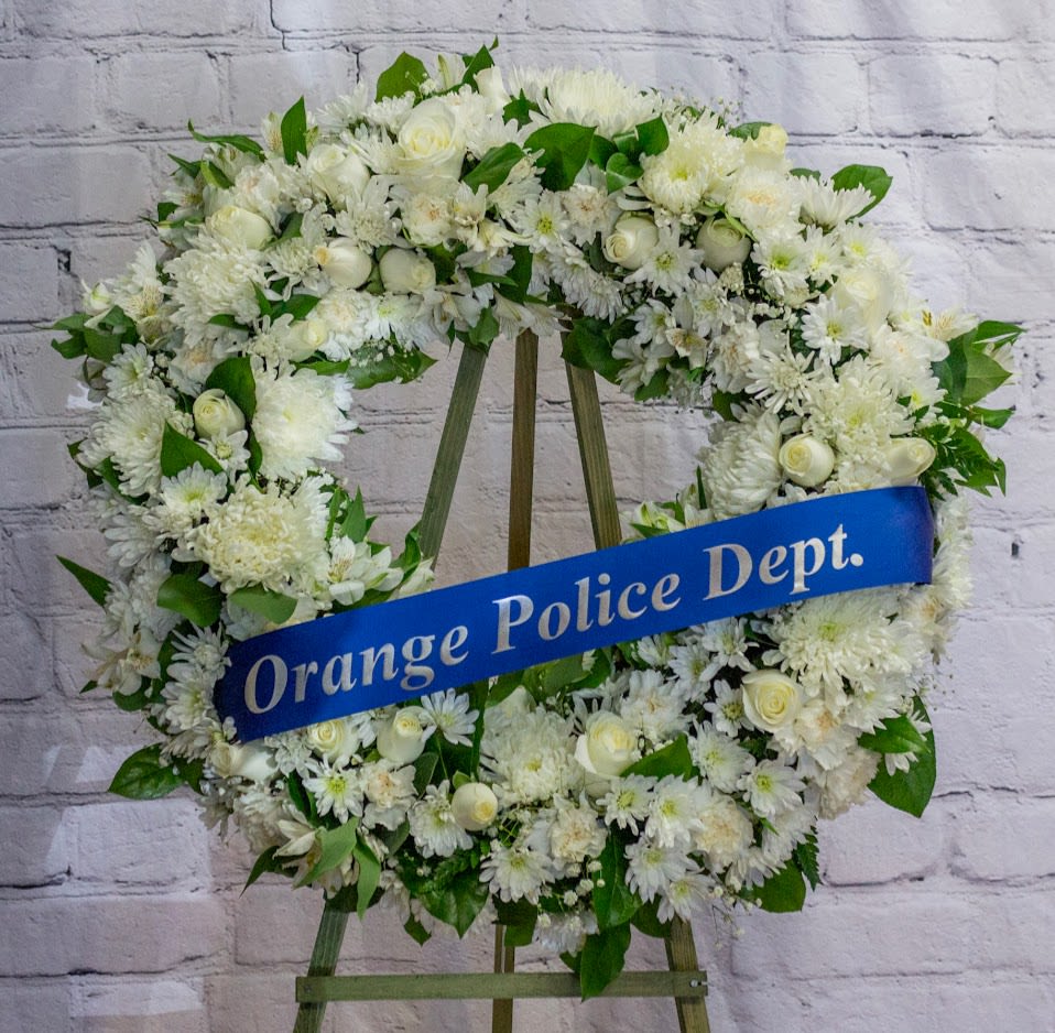 FUNERAL WREATH - Everlasting Life 9 - This is a classic option for funeral service, church or graveside. This open circle wreath will be designed with a circle form and will be delivered on a stand. This lovely mix of white roses, daisies, mums and carnations is an elegant way to send your thoughts and prayers.   **This is a piece for a funeral or memorial service. Please place the order at least 2 days prior to the service to guarantee a certain arrangement. Anything sooner and we cannot guarantee it will match the picture. These pieces can be customized to the color of your choice. The flowers may vary depending on availability of the flowers, special requests and quality of the flowers we have in stock. If you have a special request please add it to our special instructions when placing your order. If you have any questions please don’t hesitate to call. 714 289 1123**