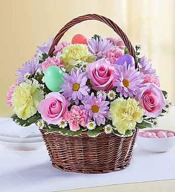 Easter Basket - Send our delightful Easter Basket bouquet, and they’ll carry your thoughtfulness with them through the holiday and beyond. We’ve gathered the freshest blooms in pastel shades of pink, yellow, and lavender inside a rustic basket with colorful Easter eggs for a truly lovely surprise. Our charming arrangement will make an especially lovely gift for the holiday host.