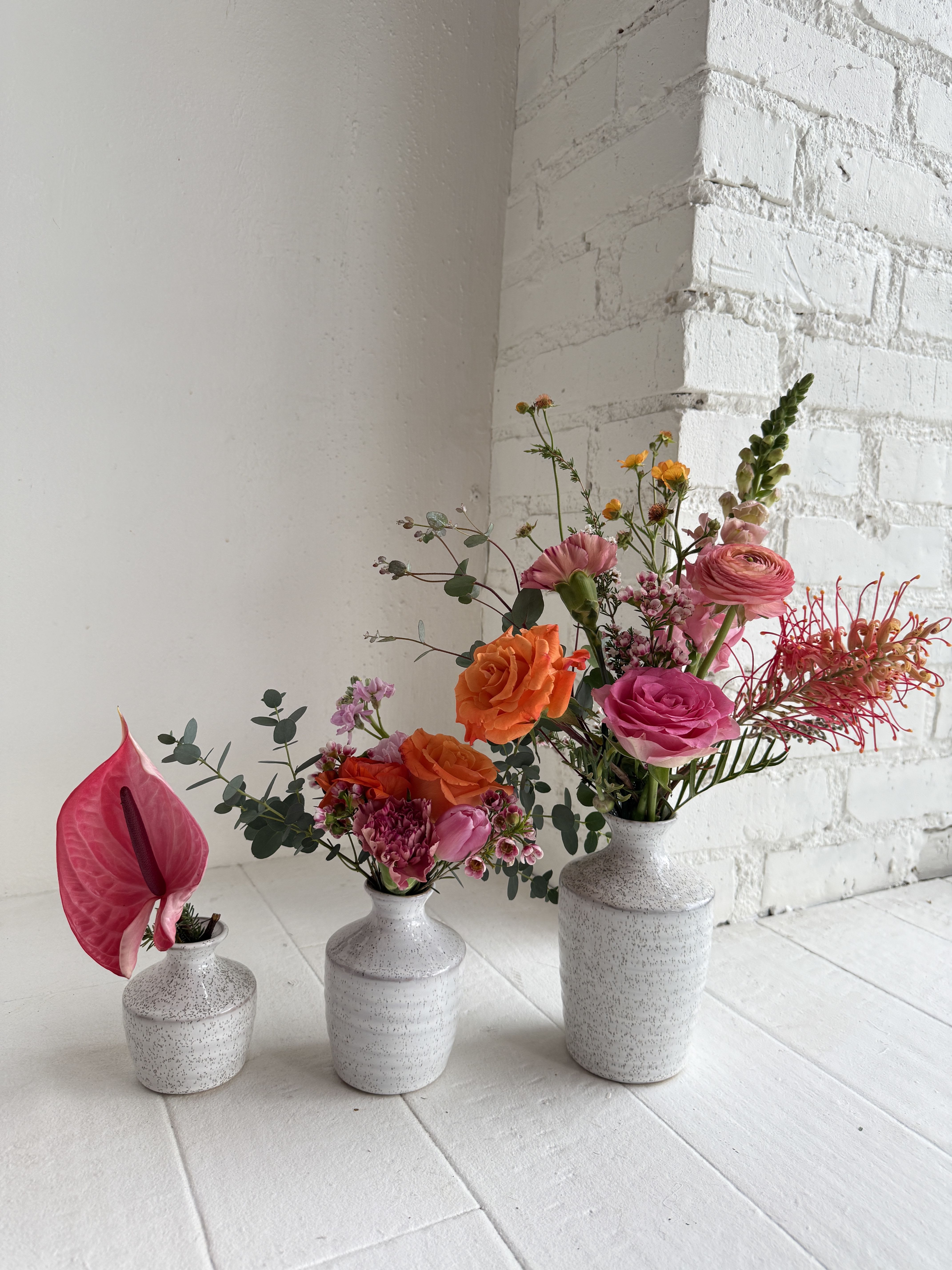 Lani - A fun eclectic mix of bright pinks and orange. Arrives in a set of three vases.