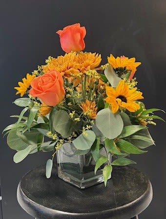 #A042 - Creamsicle Summer - This gorgeous cube arrangement reminds you of hot summer days spent enjoying a cold, sweet treat!  If you prefer it in a different color, call us at 540-810-2161 or 540-820-1509 to see what is freshest!