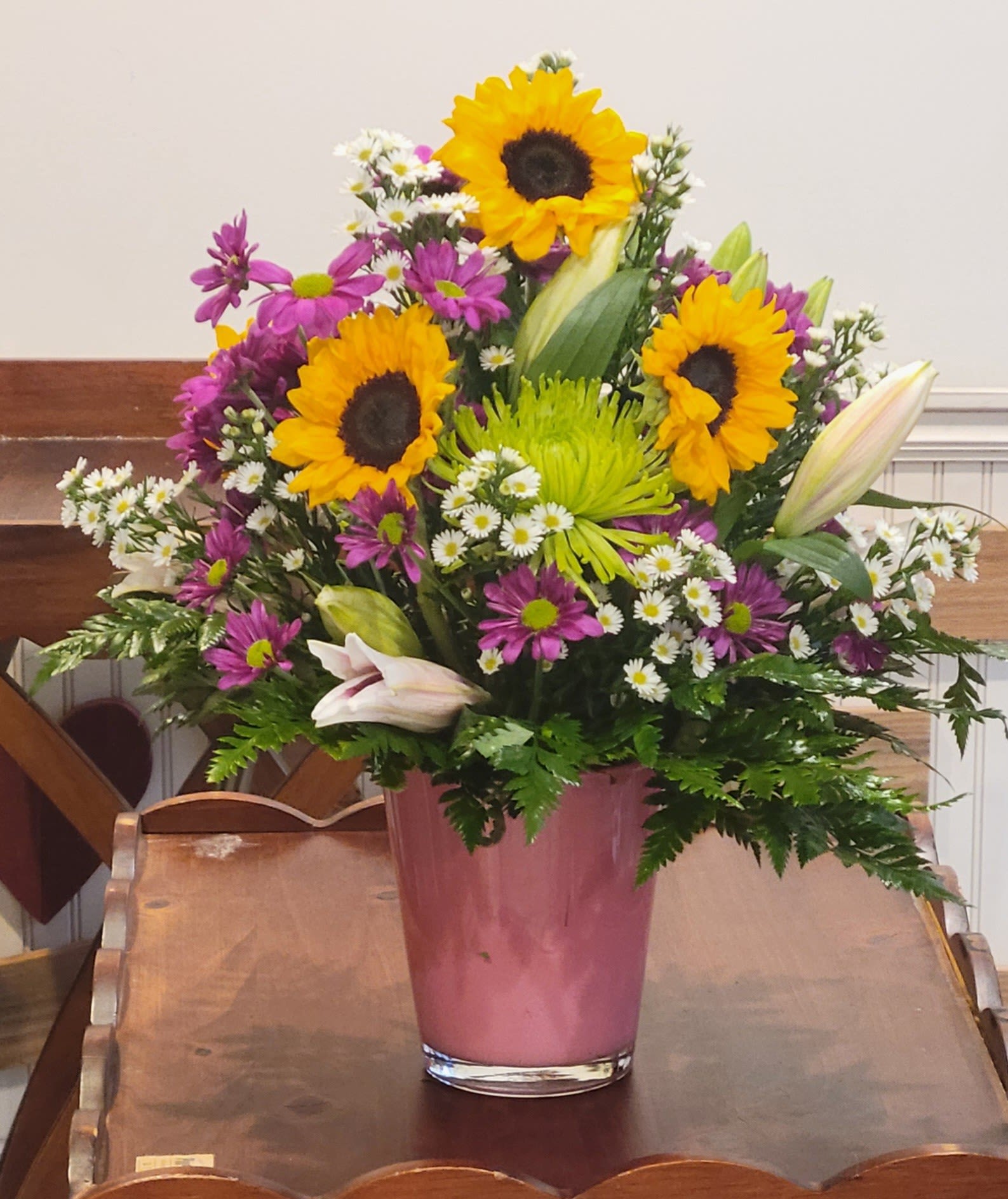 Beginning to look a like Spring by Dixie's Flowers - Love the combination of lilies, sunflowers and daisies to bring in the spring.