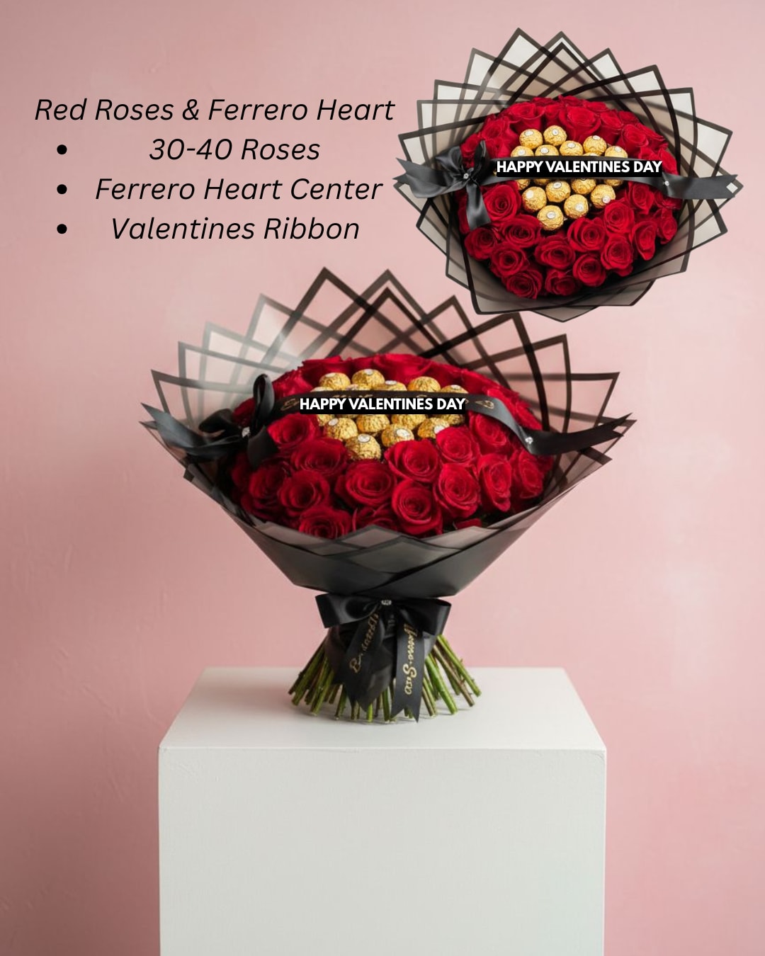 Large bouquet of red roses with gold-wrapped chocolates in a heart center, wrapped in black paper and ribbon
