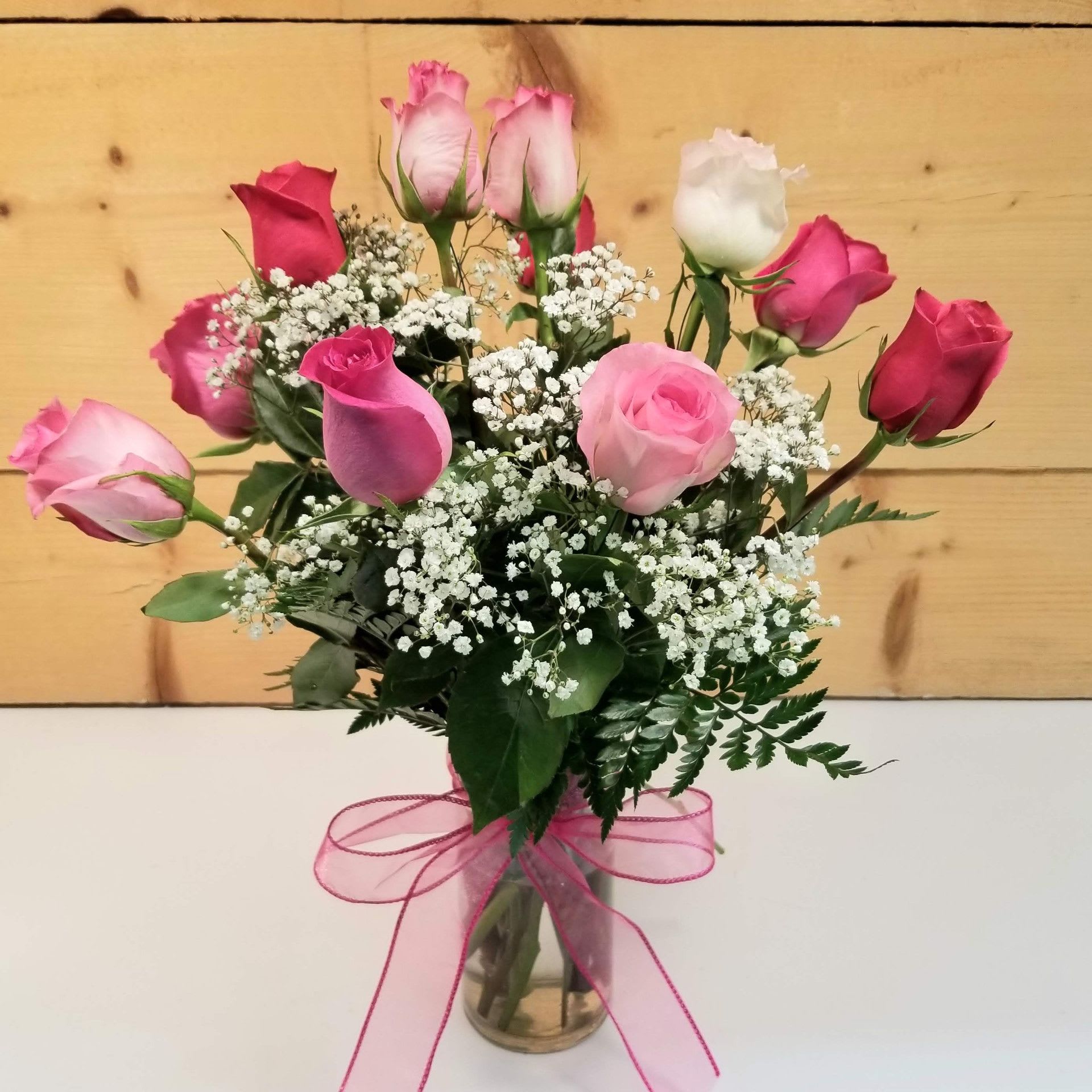 Rose Elegance Assorted - Our exquisite bouquet of magnificent, long-stem assorted roses, hand-crafted by our expert designers, complements any occasion with unforgettable style. Because only the freshest roses are selected for this arrangement, actual rose colors will vary due to availability