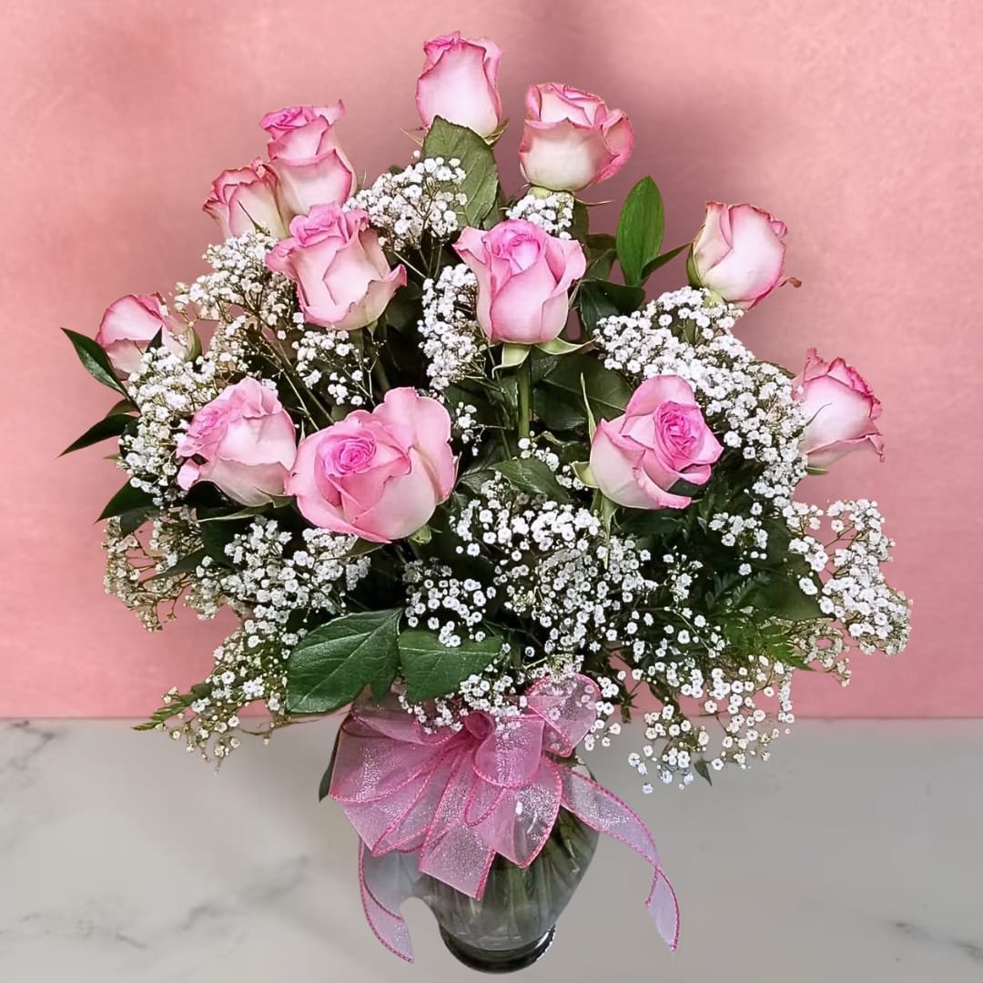Rose Elegance Pink - One dozen long-stem pink roses are just the gift when you want to express yourself with all the grace, sophistication and elegance they deserve--and more. Give fresh romance and passion with this beautiful, hand-crafted arrangement of premium long-stem pink roses.    PLEASE NOTE: Some flowers, plants, vases and other products pictured are subject to availability, and may be substituted for a similar color / style item if unavailable according to our substitution policy.