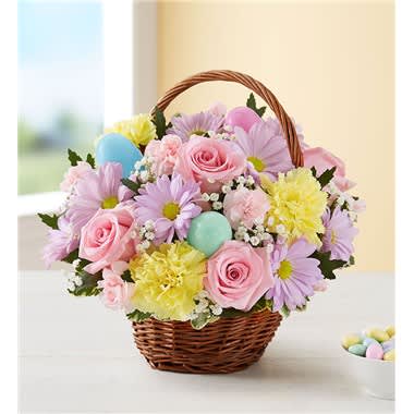 Easter Egg Basket - A delightful way to deliver Easter wishes. We’ve gathered fresh-picked pastel blooms and colorful eggs inside a charming handled basket. It’s a gift of instant happiness for family and friends, both near and far.