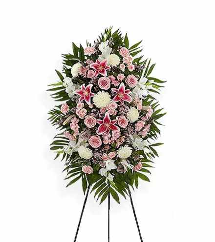 Pink Tribute Spray by Teleflora - With a bounty of lovely pink flowers and simple greens, this pretty spray lets you express your sympathy beautifully.  