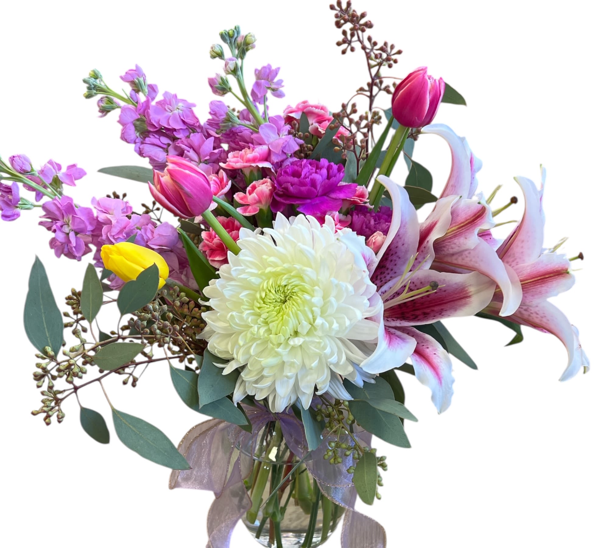 Spring romance - Features vibrant tulips, lilies, violets, carnations, chrysanthemum, and greenery .