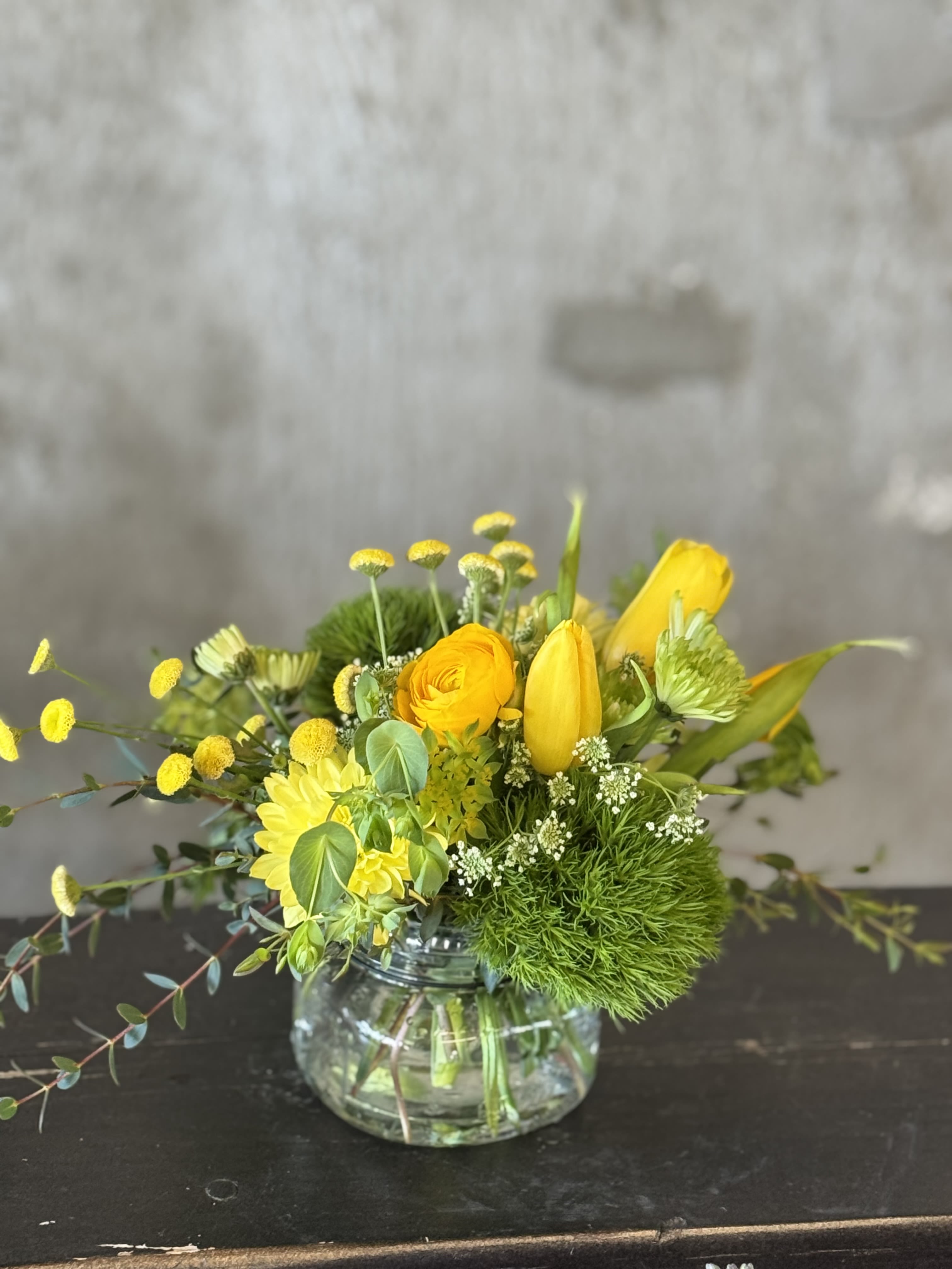 Seasonal Mason Jar Mix - The Seasonal Mason Jar comes arranged with a beautiful mix of seasonal blooms and textures, all playfully designed in one of our hand-picked designer bud vases.  Only comes in 1 size. Photos are a representation of what could be sent. Please specify any preferences (if applicable) and we will do our best to accommodate or call our studio! 