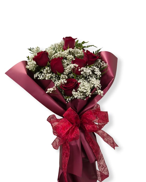Half Dozen Medium Stem Rose Cello - This timeless half dozen rose wrapped bouquet, elegantly presented in specialty paper makes the perfect gift. Accented with delicate filler flowers and lush greens for soft, romantic finish. Bouquet includes a water source to keep blooms fresh for several hours.  Vase not included.