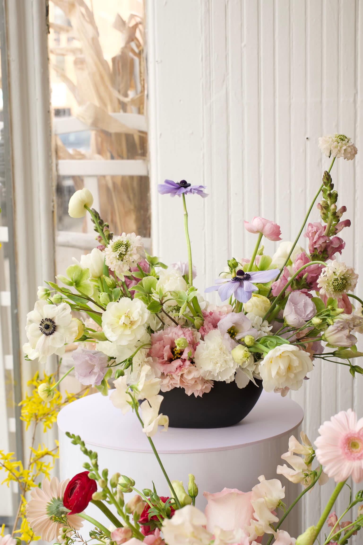 Spring Equinox -  Indulge in the opulence of spring with this sumptuous arrangement of snapdragon, anemones, freesias, and ranunculus.  Comes in a classical designed vessel.  