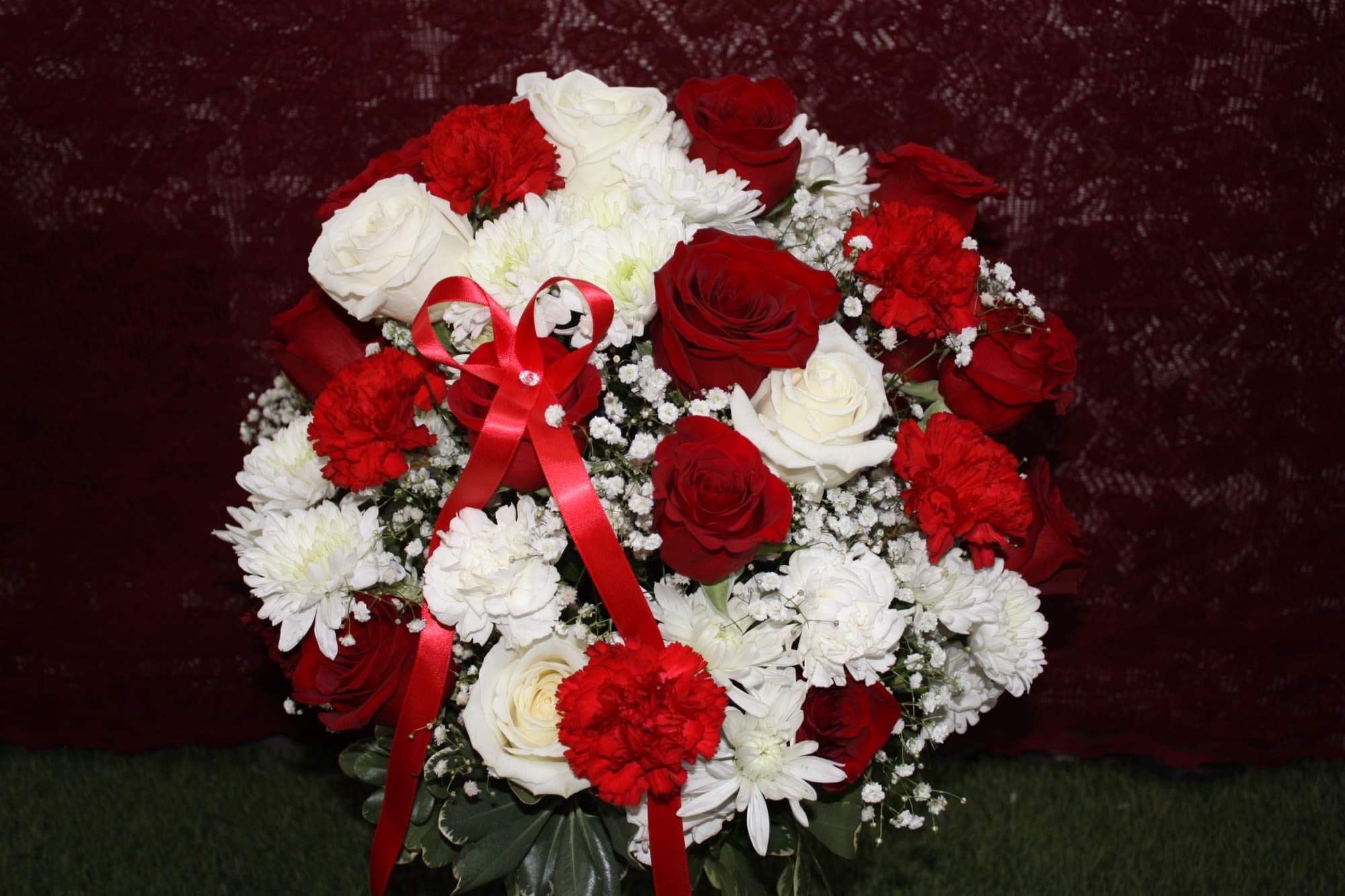 roses in the clouds  - red and white roses over 24 roses in standard plus white and red fillersBand white roses  poms and babies breath perfect for any occasion