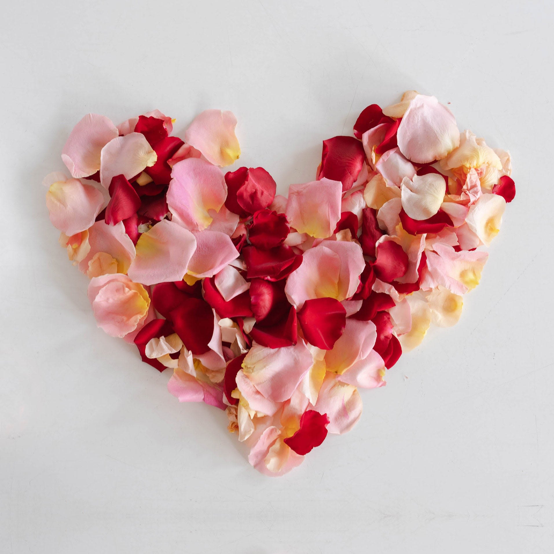 Rose Confetti - The prettiest rose petals to make any occasion or event extra special. We'll prep gorgeous fresh pink, peach and read rose petals and arrange in a gift box with satin ribbon. Just sprinkle to create magic.