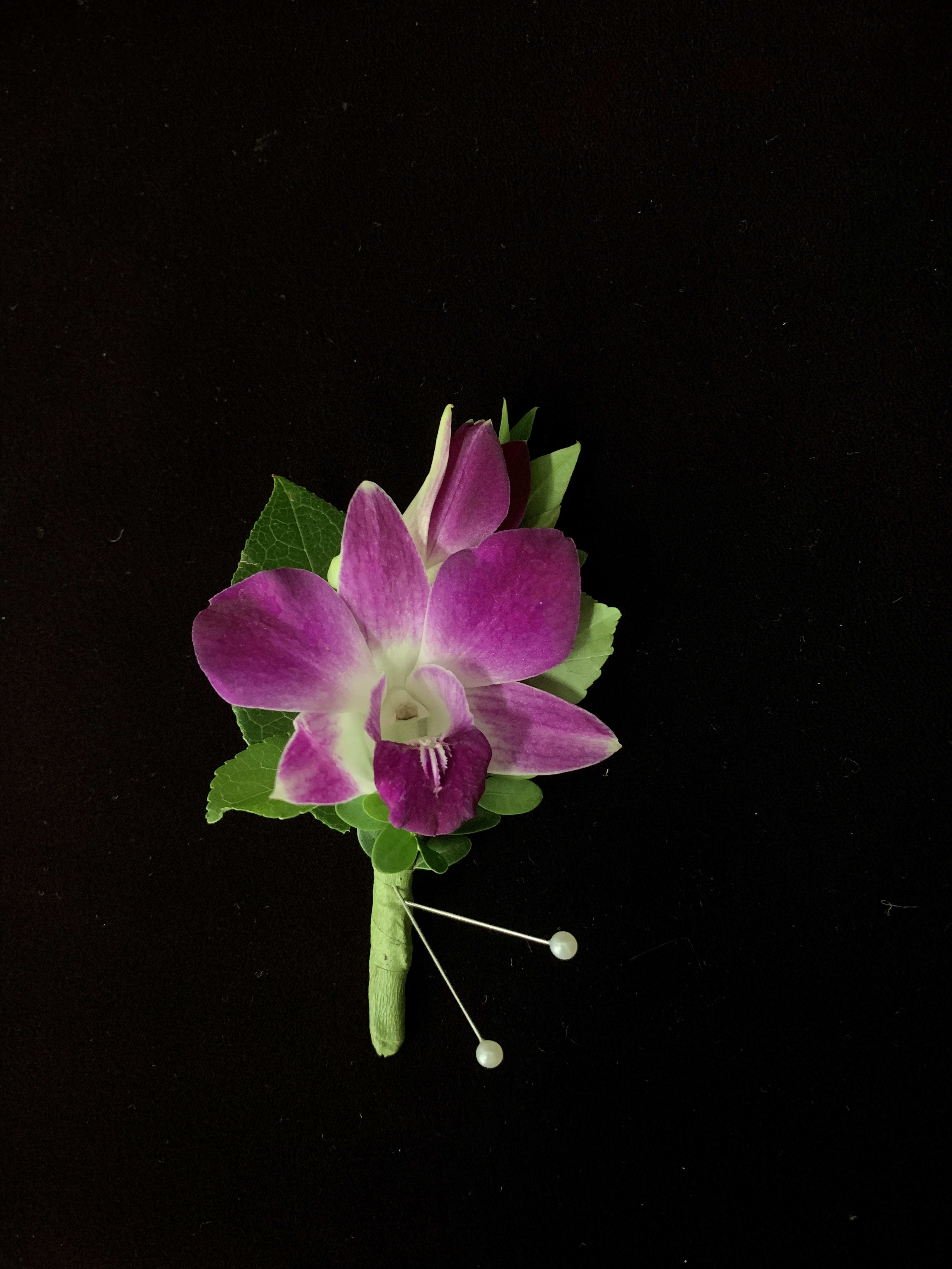 Orchid Boutonniere - A Boutonniere featuring Purple or White Dendrobium Orchid Blooms with with green accents. Please call us to place your order for pick up. 703-356-9377