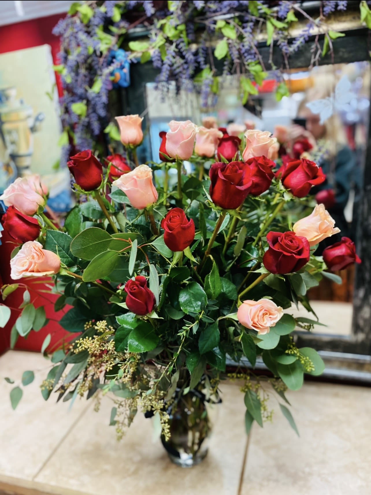 24 Pink&amp; Red Rose Bouquet  - 24 Pink &amp; Red Roses Bouquet A stunning blend of passion and grace, this romantic bouquet features twenty-four premium pink and red roses accented with fresh greenery. Red roses symbolize deep love and devotion, while pink roses express admiration and sweetness—together creating the perfect harmony of heartfelt emotion. Expertly hand-tied and beautifully wrapped, this bouquet is ideal for anniversaries, or any moment meant to say  “I love you” in a truly unforgettable way.