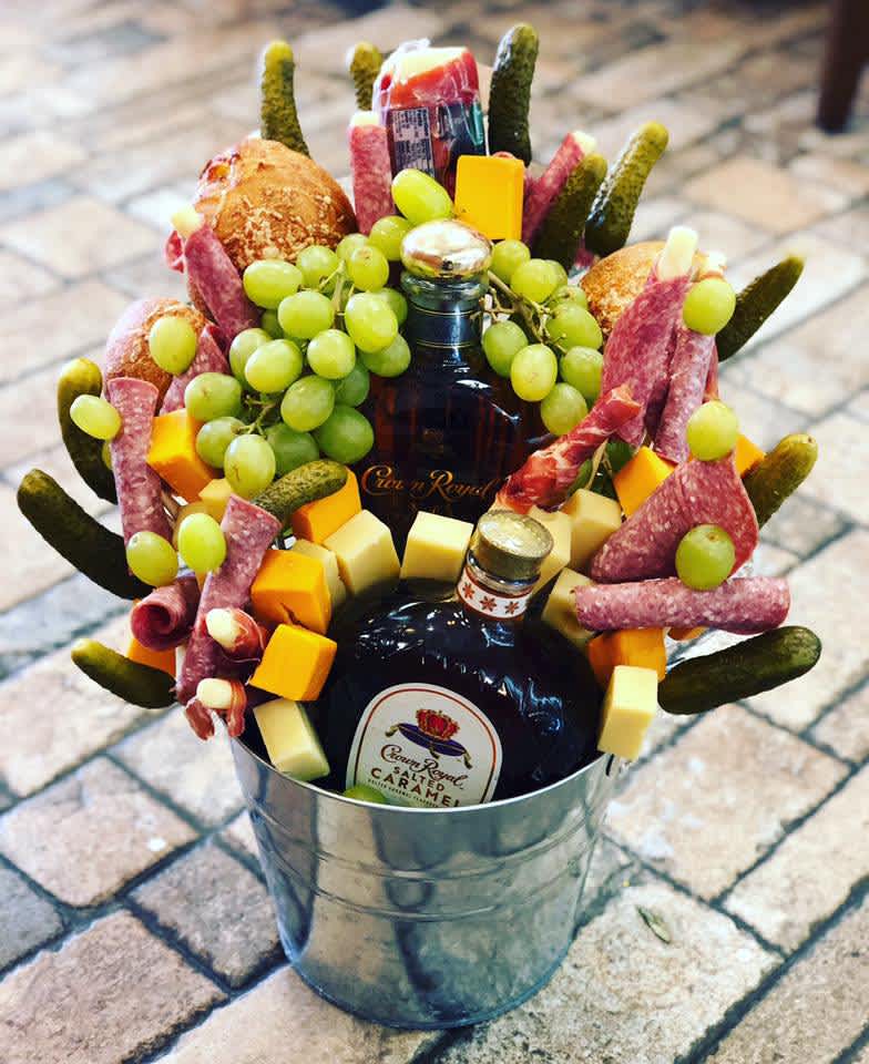 Crown in a Bucket  - *CUSTOMER MUST SUPPLY ALCOHOL*  A delicious bouquet made for that special guy in your life, includes cheese, meat, fruits, and other appetizers. 