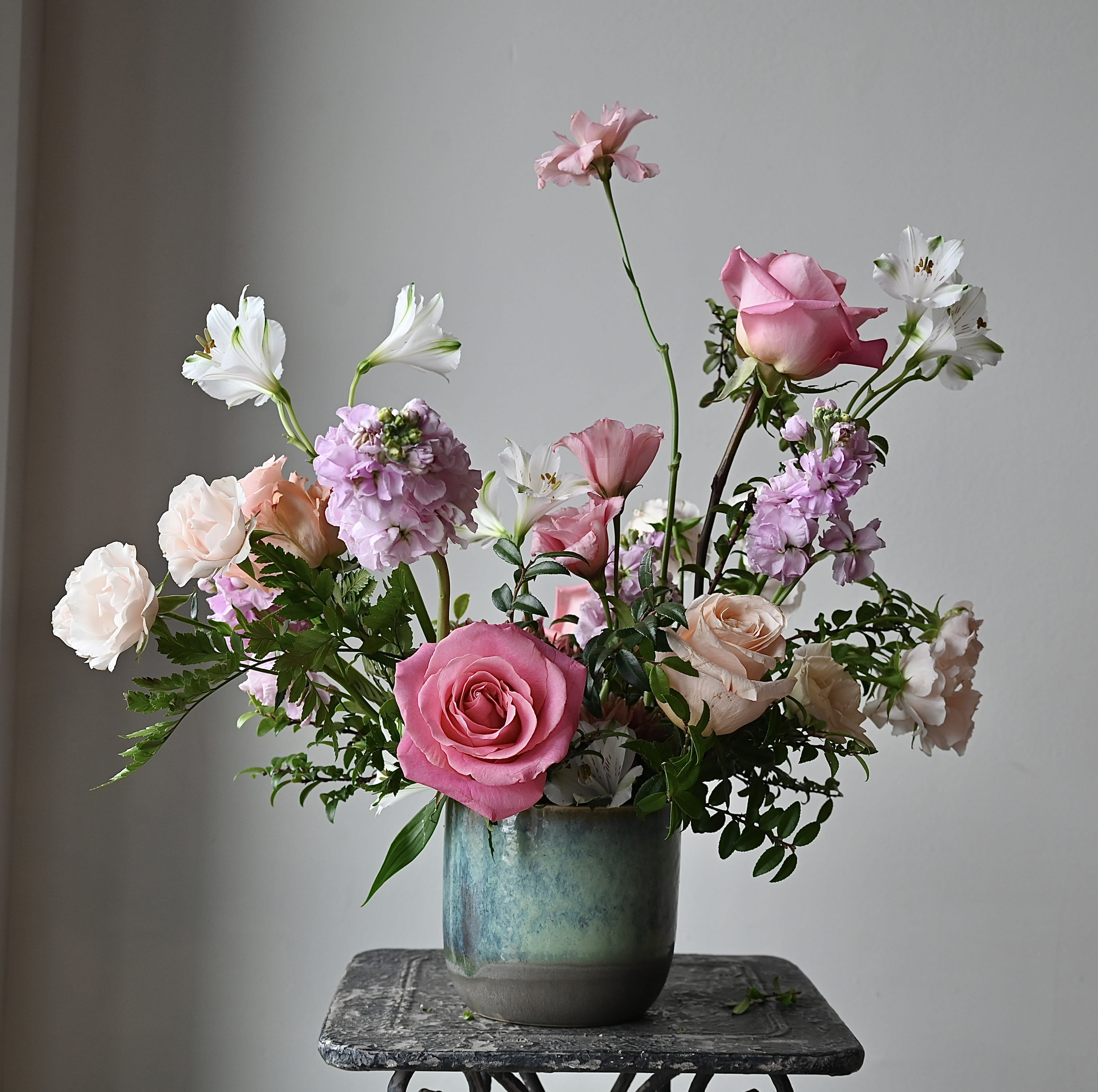 THE SERENITY - Calming blues and greens are a serene backdrop to a garden style arrangement that will feel airy and whimsical.  Our team of expert designers will select the perfect seasonal floral and color palette combinations for a custom, unique and beautifully designed arrangement.  Each bouquet is packaged in our signature white tissue and wrapped in our black, textured logo ribbon.  *Please note our floral and color palette changes from week to week.  All substitutions are of equal value.