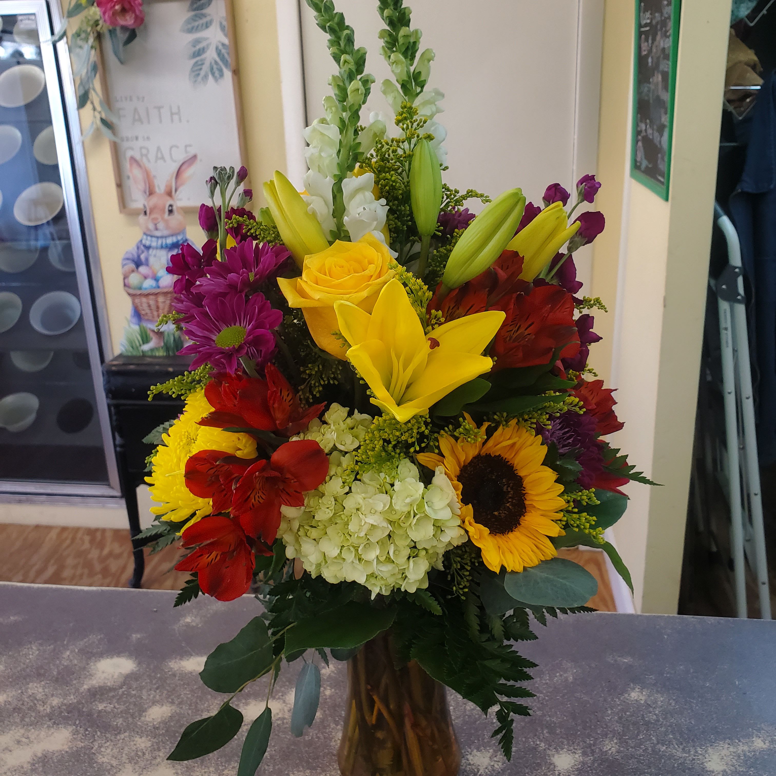 Spring Garden  - A glass vase filled with  stock,  lilies,  roses..just to name. For the flower lover. 