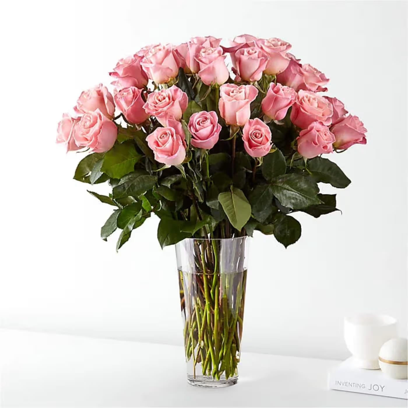 3 Dozen Pink Roses - Step into a moment of soft romance with Flower Synergy’s timeless pink rose arrangement, designed for those who appreciate classic beauty and heartfelt elegance. This stunning bouquet features three dozen premium pink roses, each bloom radiating warmth, grace, and understated luxury.  Thirty-six blush pink roses come together in a lush, full design, their delicate petals symbolizing love, gratitude, and admiration. Hand-selected for their quality and longevity, these premium roses are thoughtfully arranged by the designers at Flower Synergy to create a look that is both romantic and refined. Whether celebrating a meaningful milestone, expressing appreciation, or simply sending a thoughtful gesture, this arrangement speaks beautifully without saying a word.  Pink roses are cherished for their gentle charm and timeless appeal. Their soft hue conveys affection and sincerity, making them perfect for a wide range of occasions. With three dozen roses, this bouquet makes a generous and lasting impression, offering beauty that continues to be enjoyed for days to come. Crafted with care and delivered fresh, this Flower Synergy design is a true expression of elegant sentiment.