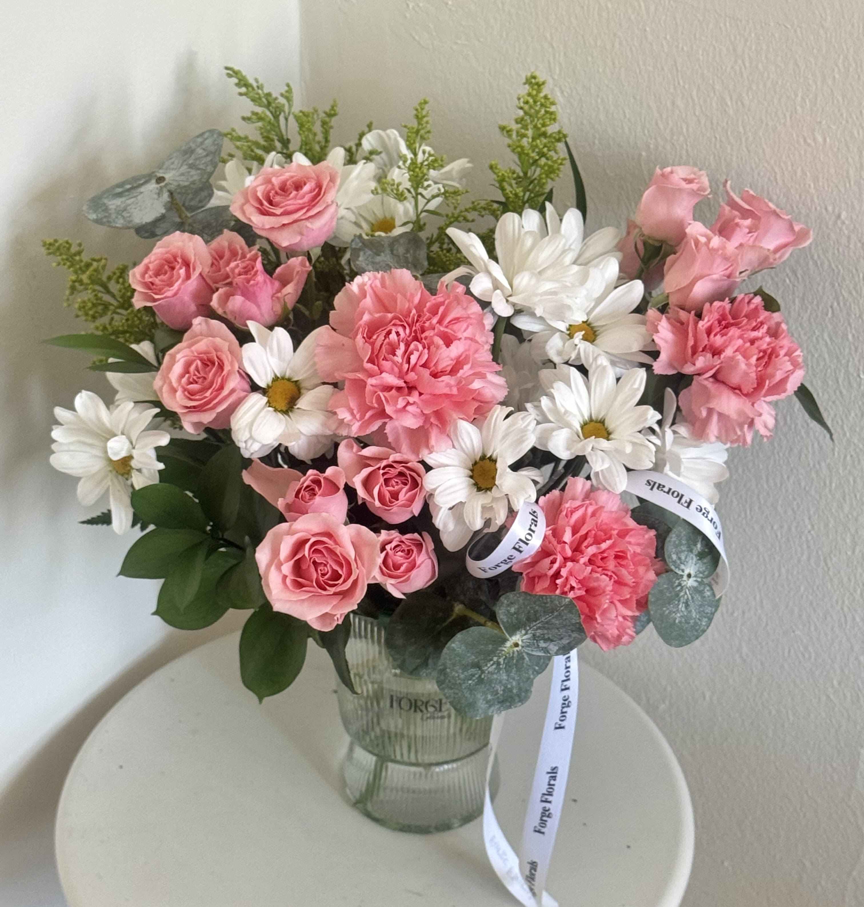 Rustic joy vase-Daisy,mini roses,Eucaliptus and solidago - Nice and cute arrangement in a plastic vase.