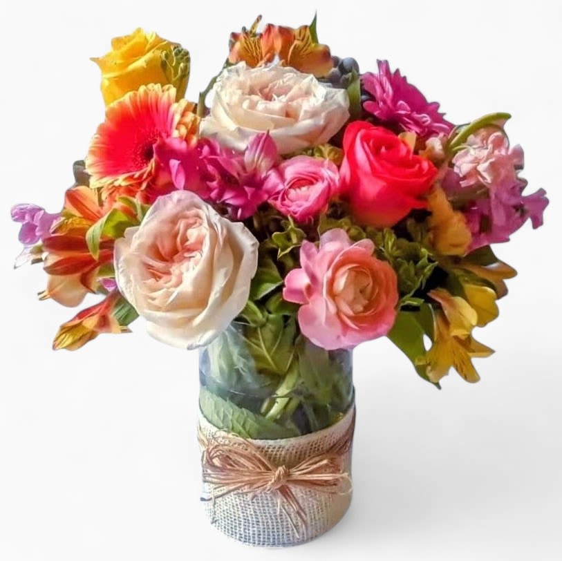 Bella Bouquet Designer's Choice - Roses orchids and so much more arranged in a tall modern glass cylinder vase wrapped in vanilla jute ribbon. Stunning and perfect to send when you want to show them how much you care. All of my bouquet designs are always made extra special and unique each and every time. Please visit my beautiful gallery. Send them lots of happiness today.